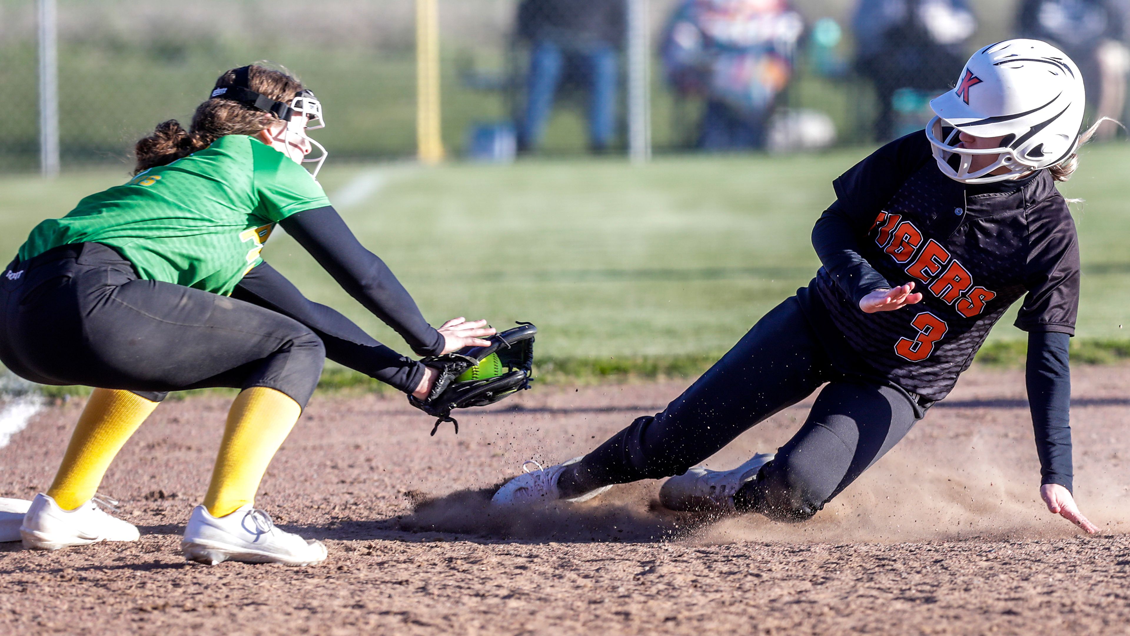 Kendrick's Harley Heimgartner goes into a slide as Potlatch's Emma Chambers prepares to tag her out. Potlatch defeated Kendrick 12-11 in the Class 1A district final in Genesee on Wednesday.