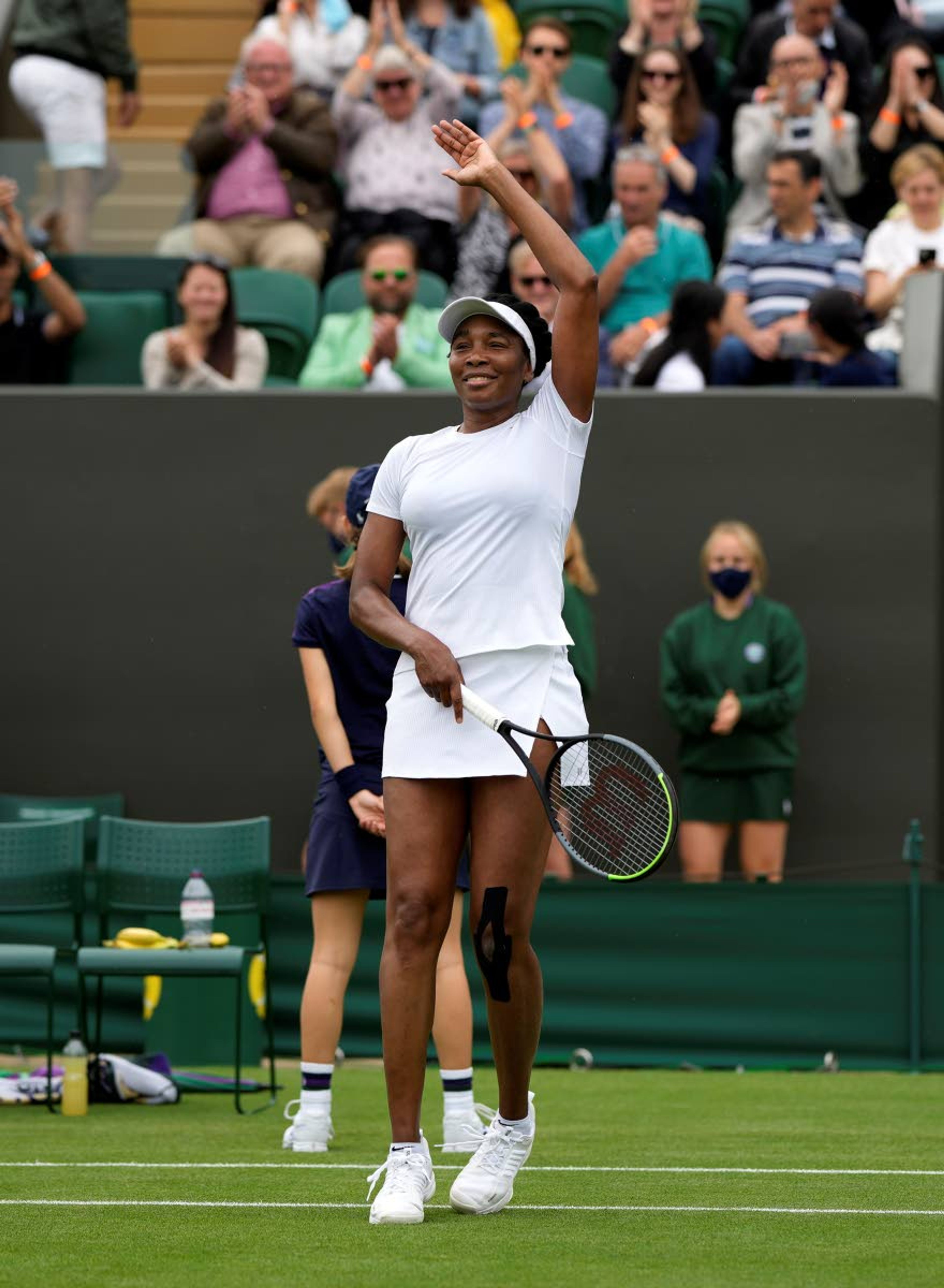 Venus Williams of the US celebrates winning the women's singles first round match against Romania's Mihaela Buzarnescu on day two of the Wimbledon Tennis Championships in London, Tuesday June 29, 2021. (AP Photo/Alastair Grant)