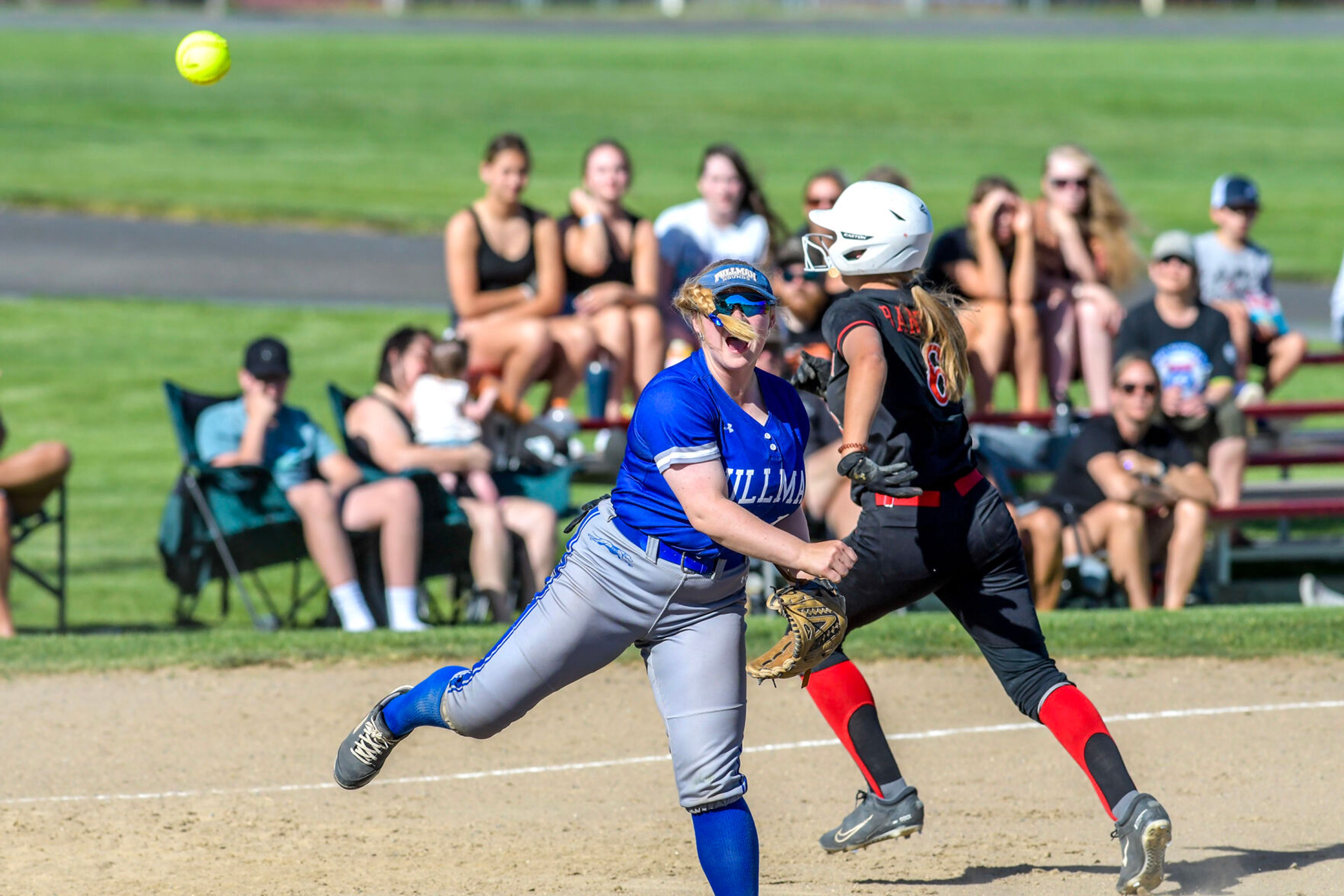 Pullman third baseman Cori Stewart throws to first base against Clarkston in an inning of a district tournament semifinal round game Thursday in Clarkston.