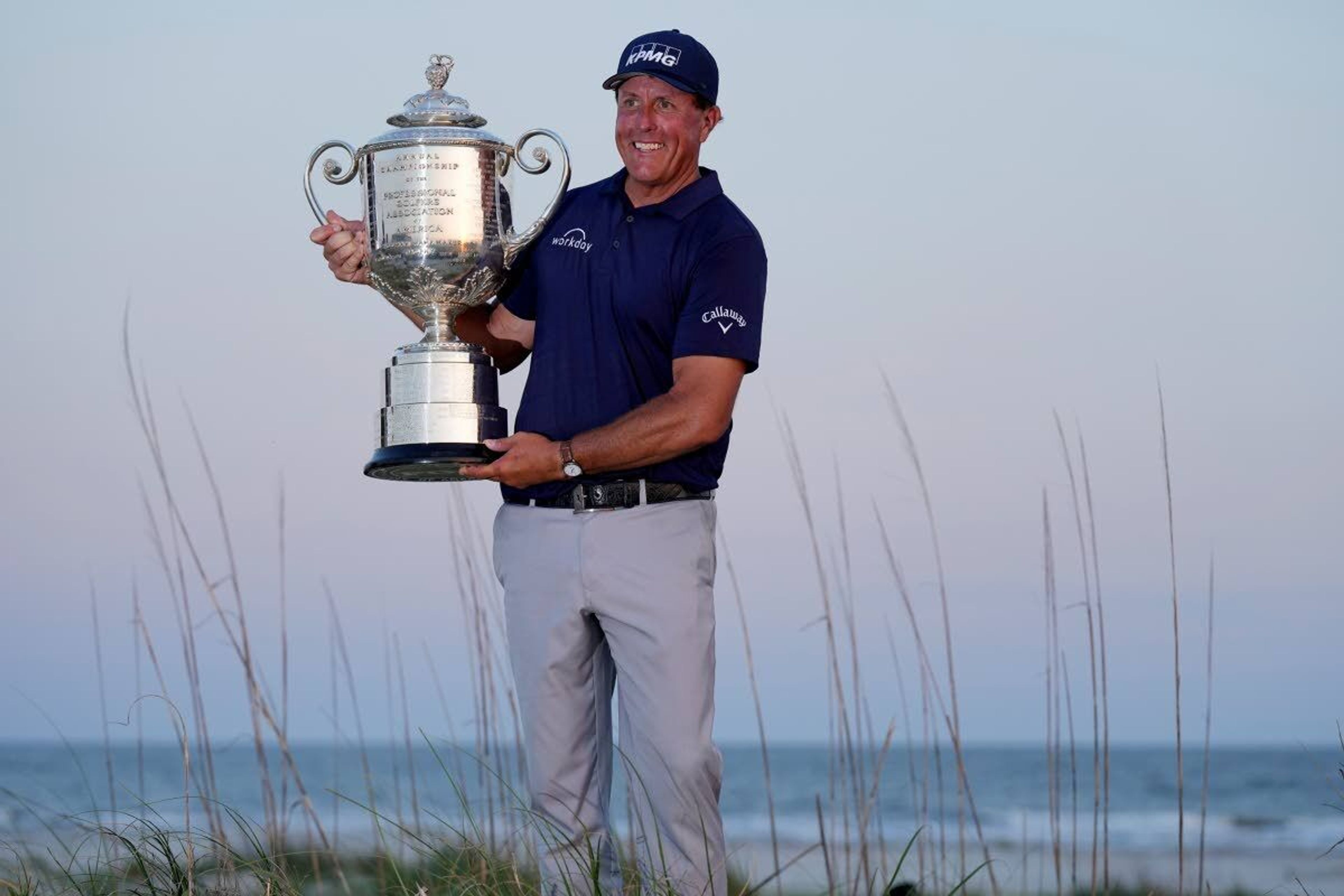 Phil Mickelson holds the Wanamaker Trophy after winning the PGA Championship golf tournament on the Ocean Course, Sunday, May 23, 2021, in Kiawah Island, S.C. (AP Photo/David J. Phillip)