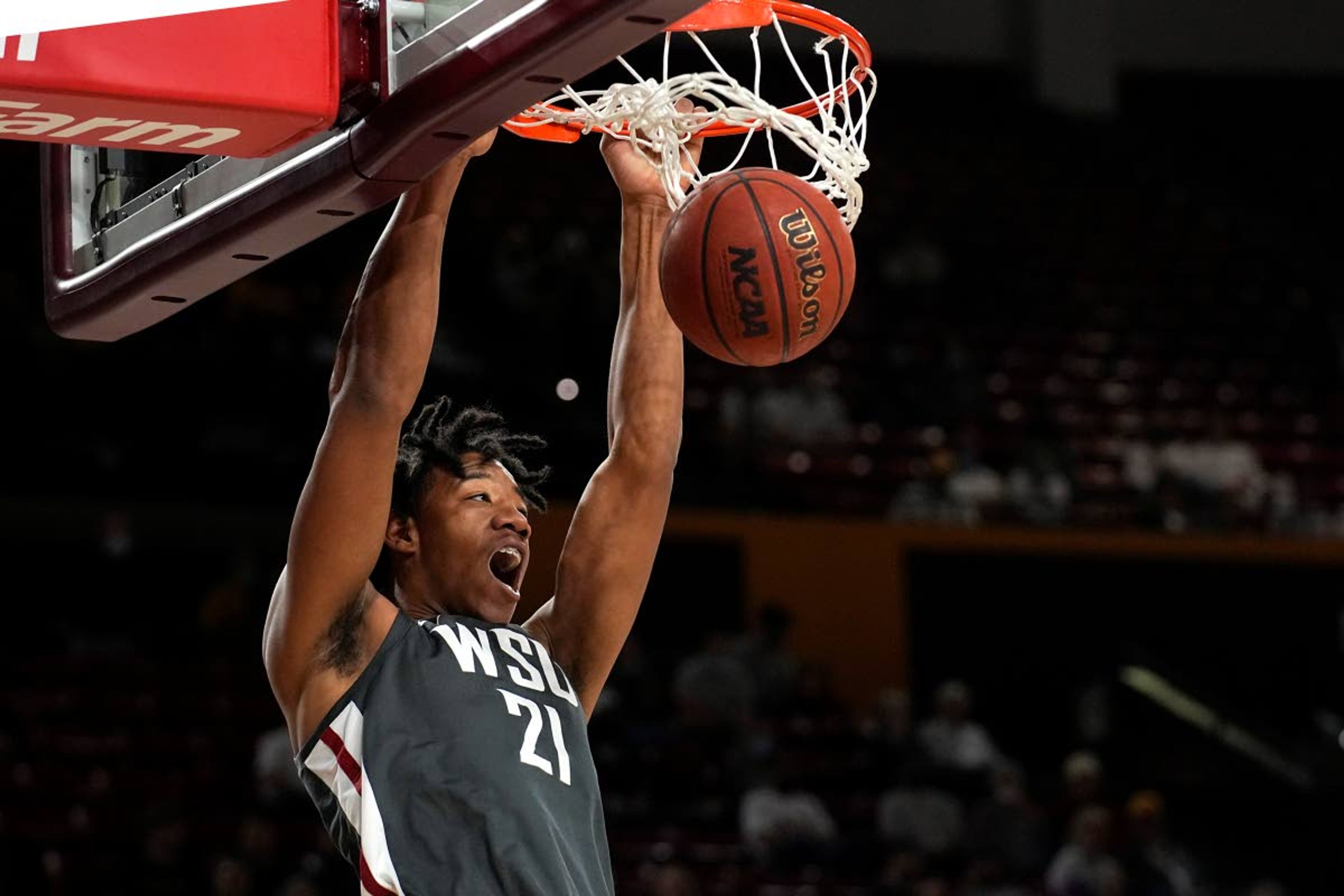 Washington State center Dishon Jackson dunks against Arizona State during the first half of an NCAA college basketball game, Wednesday, Dec. 1, 2021, in Tempe, Ariz. (AP Photo/Rick Scuteri)