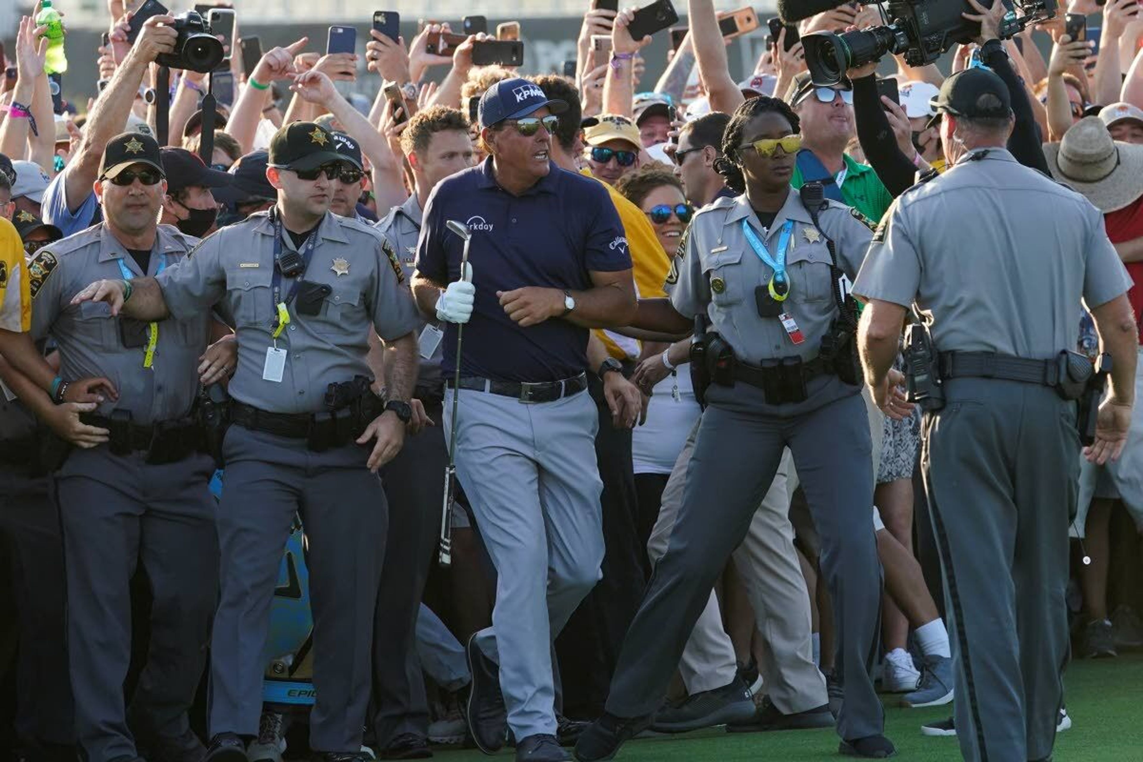 Phil Mickelson wades through fans on the 18th fairway during the final round at the PGA Championship golf tournament on the Ocean Course, Sunday, May 23, 2021, in Kiawah Island, S.C. (AP Photo/Matt York)