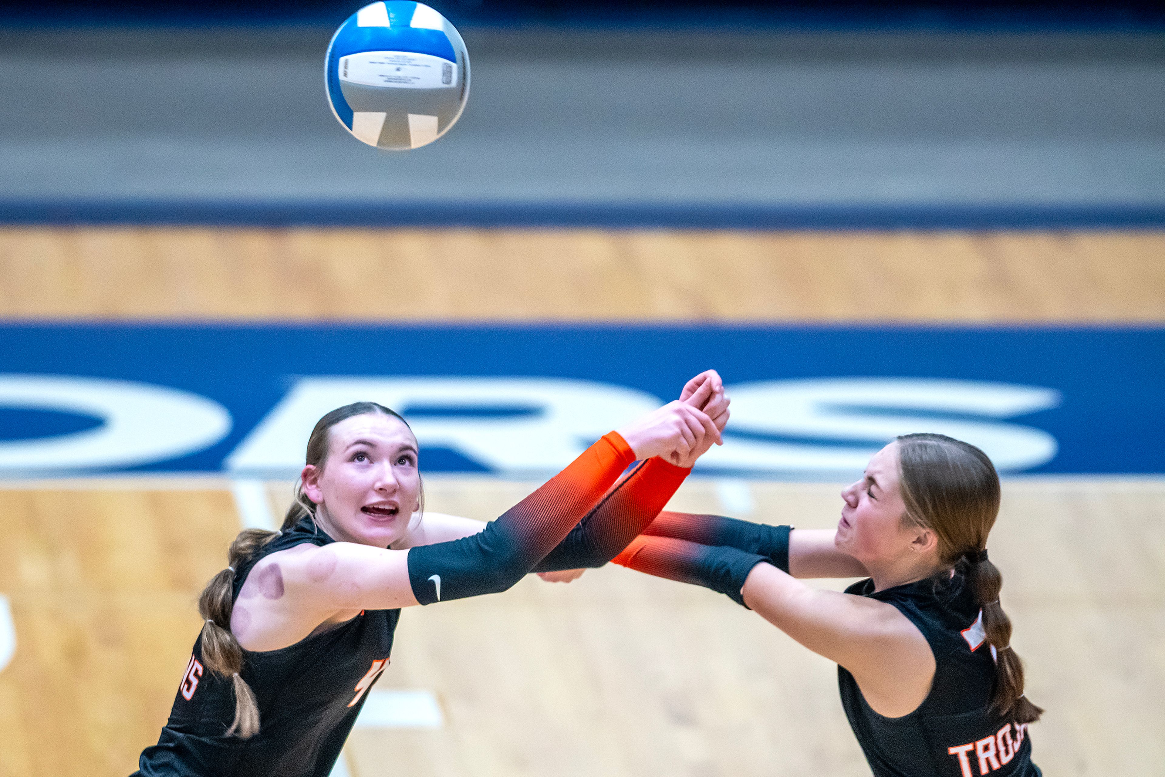 Troy outside hitter Tessa Stoner, left, keeps the ball in play against Potlatch during a 2A district championship Wednesday at the P1FCU Activity Center in Lewiston.