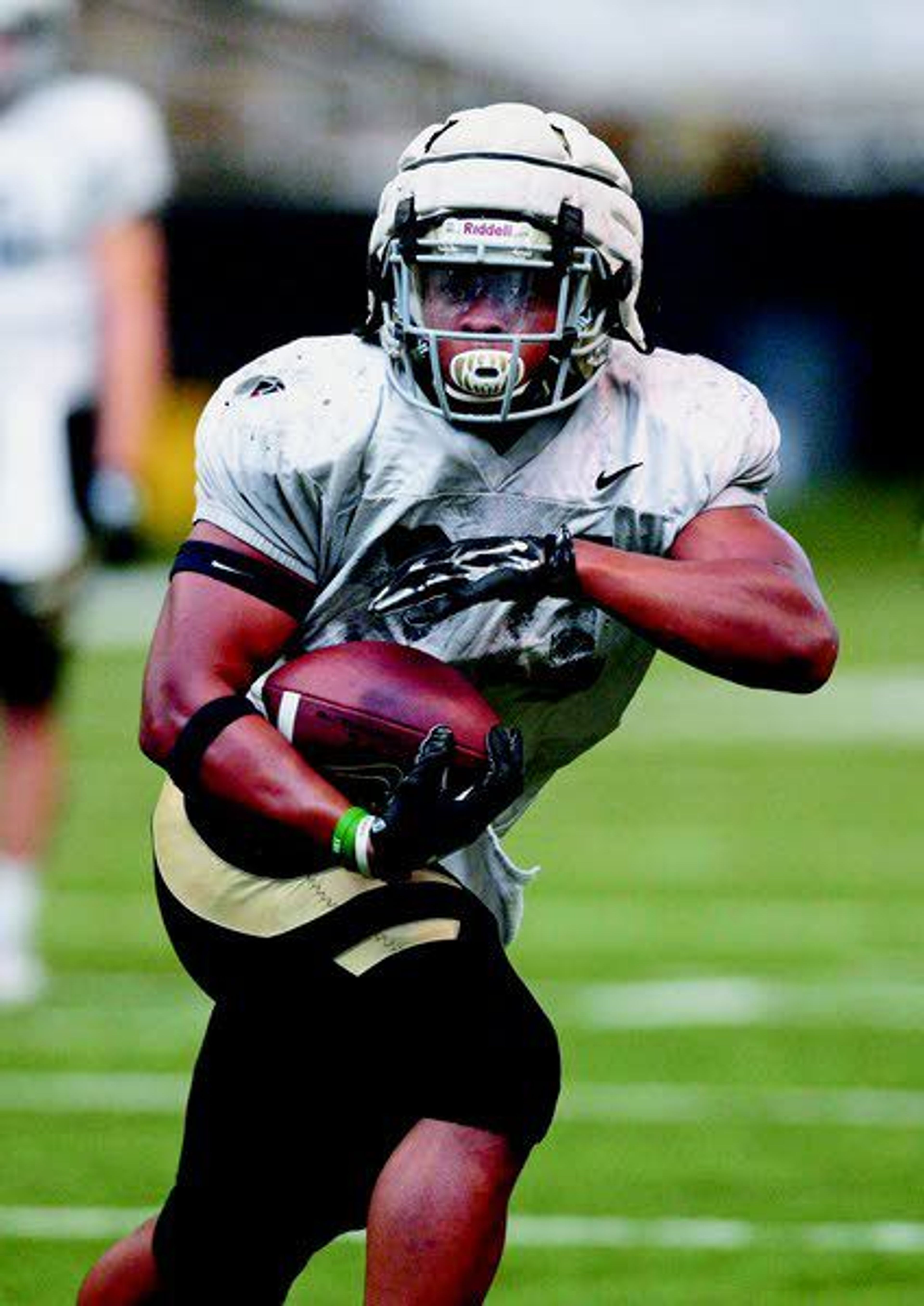 Running back Roshaun Johnson carries the ball during a Vandal scrimmage Saturday morning in the Kibbie Dome.