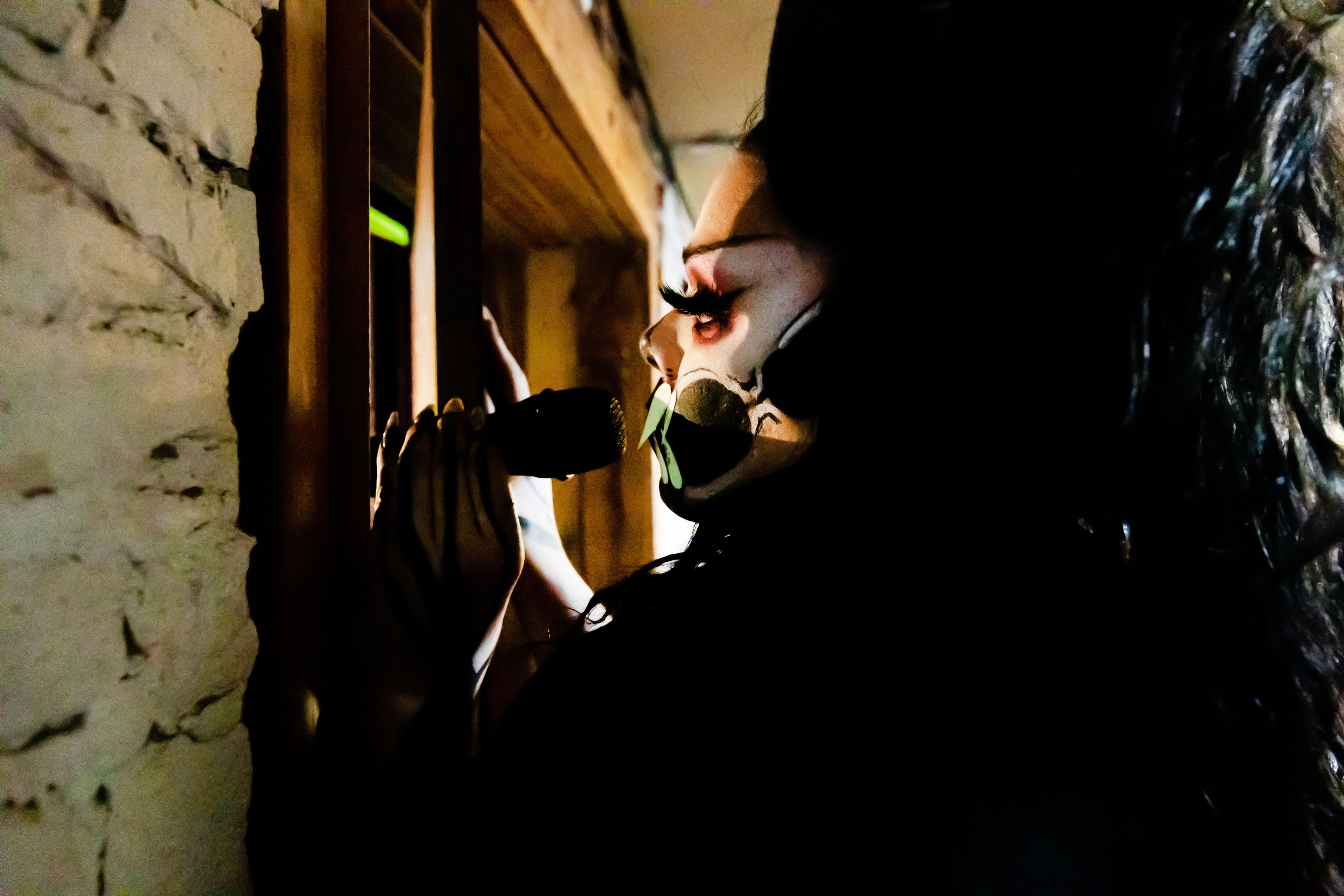 Wabaunsee MC’s while looking out at the crowd from the greenroom March 15 during the second night of the Lipstick Divas drag show at the boomtown Saloon