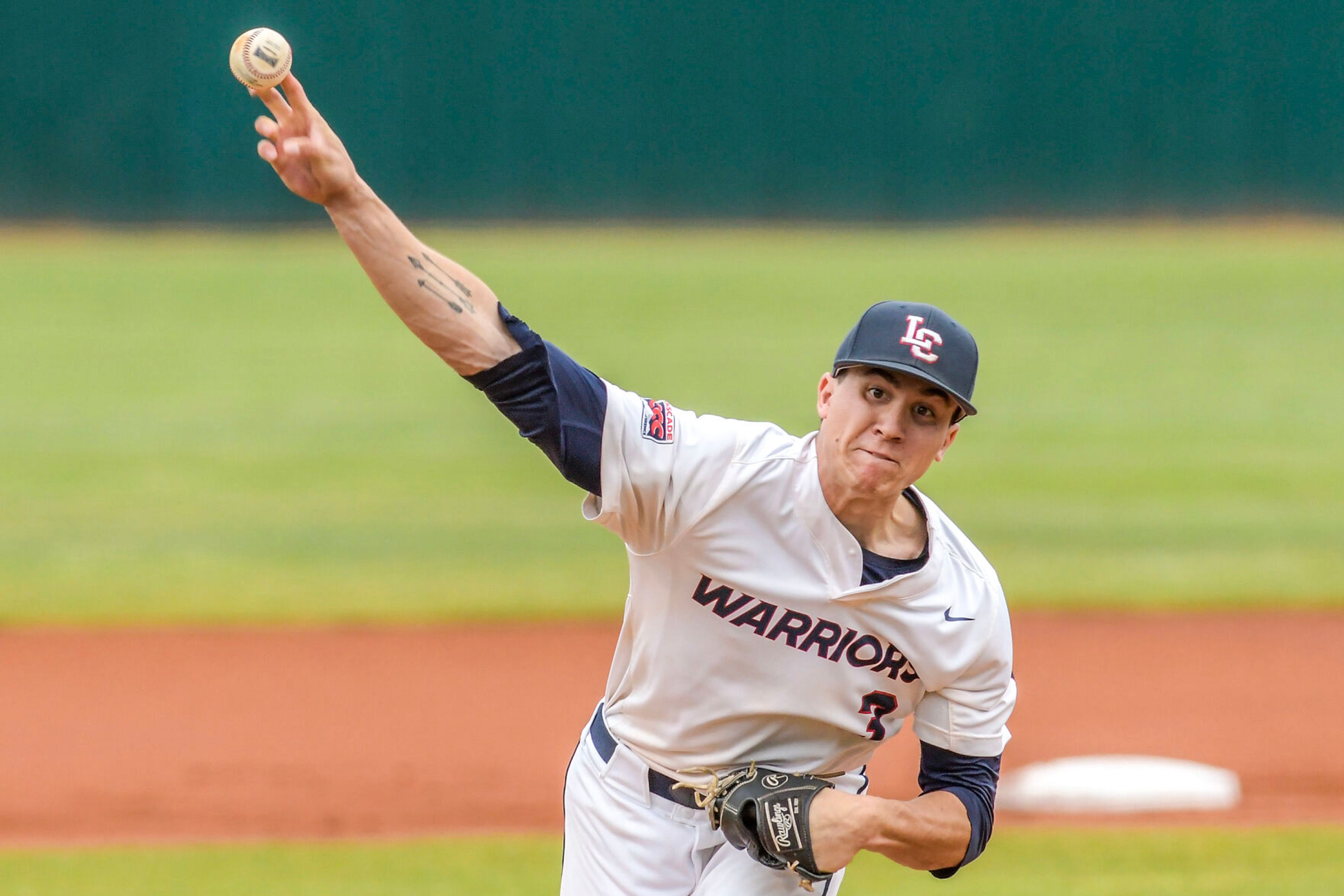 Lewis-Clark State pitcher Drake George throws a pitch against Bushnell in an inning of a first round game of the Cascade Conference Tournament at Harris Field in Lewiston.