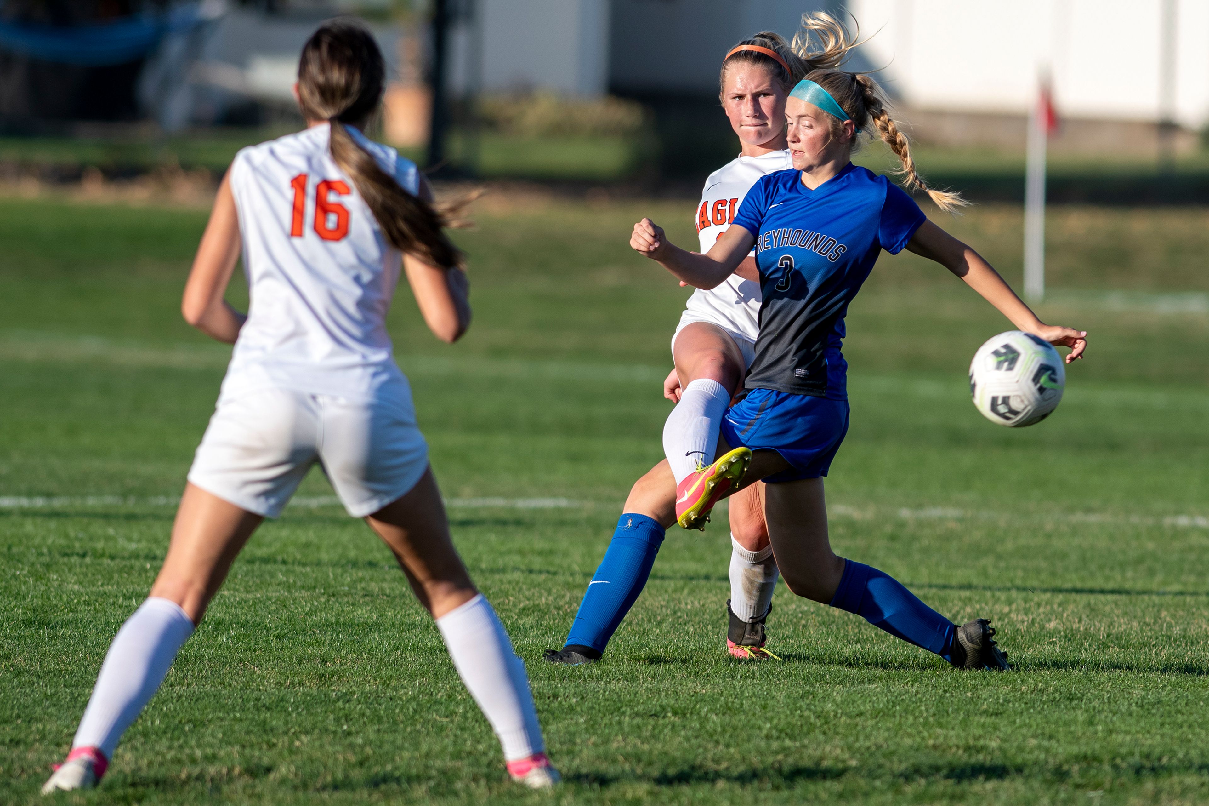 West Valley’s Ashlyn Chase (11) passes the ball around Pullman’s Meg Limburg (3) during a Class 2A Greater Spokane League game at Pullman High School on Tuesday.