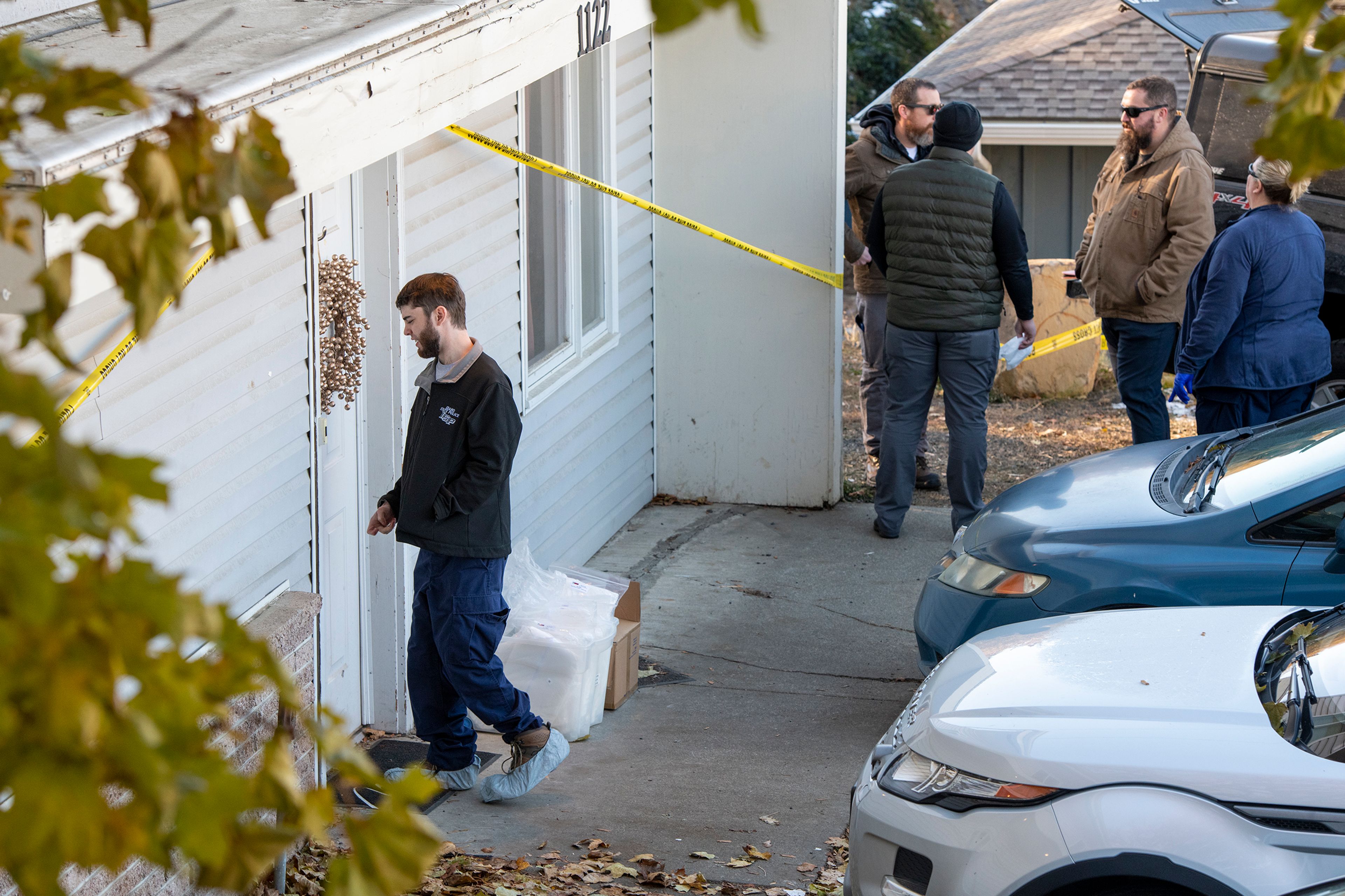 Members of the Idaho State Police forensic team investigate Friday at a home where four University of Idaho students were recently murdered over the weekend in Moscow.