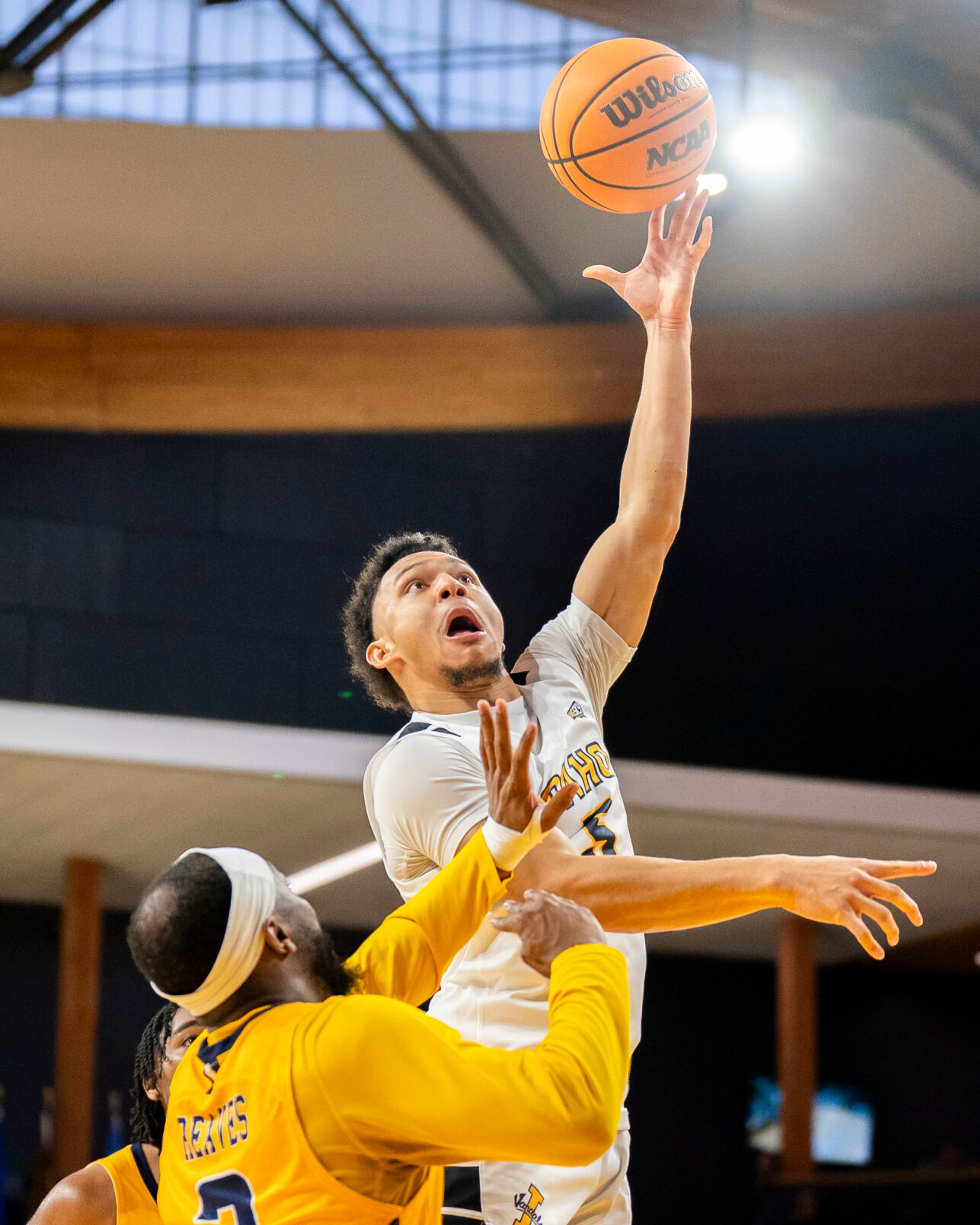 Idaho’s D'Angelo Minnis, right, shoots the ball during a game against Northern Colorado on Jan. 27 at ICCU Arena in Moscow.