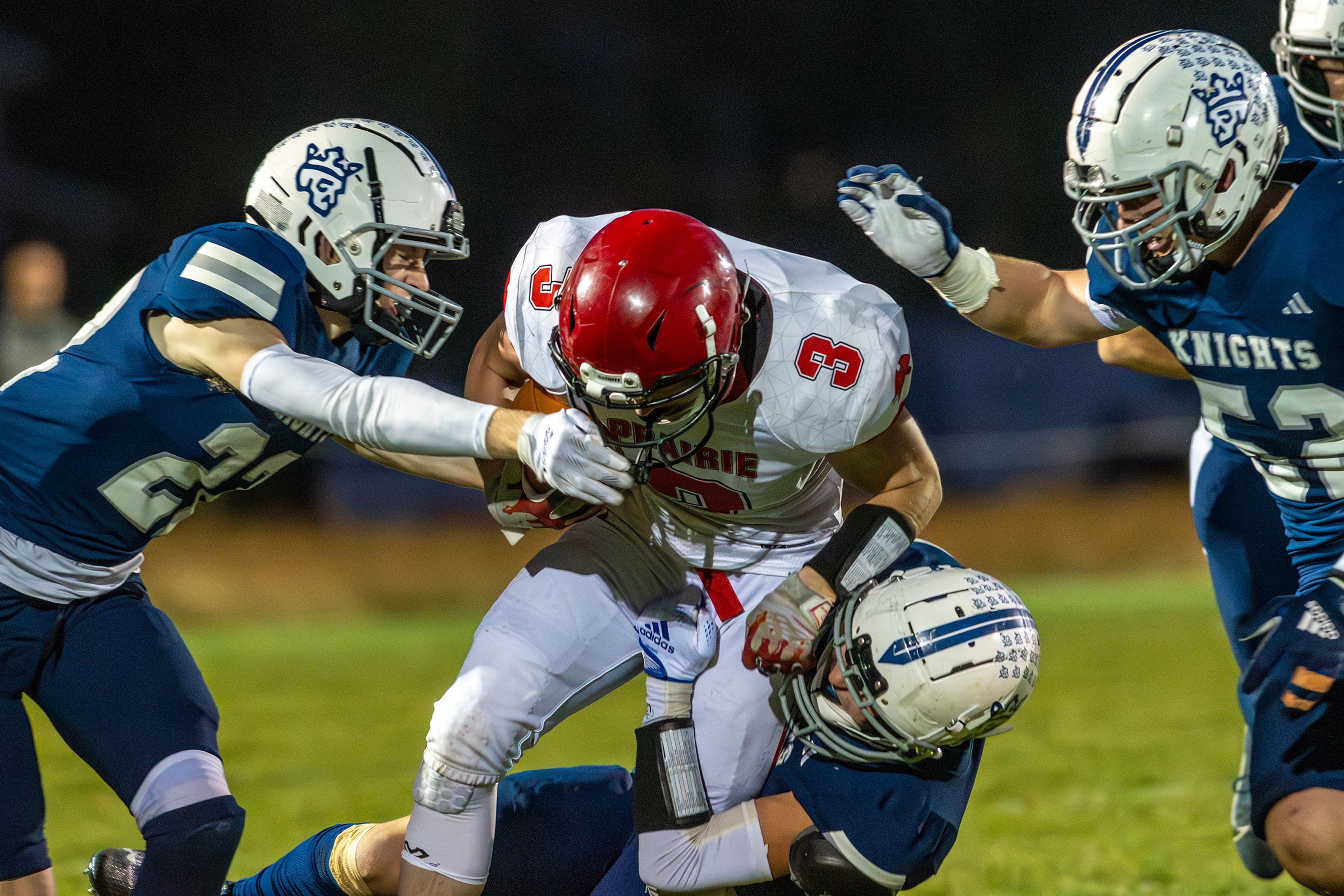 Prairie Dylan Uhlenkott is brought down by multiple Logos players during a conference game Friday in Moscow.,