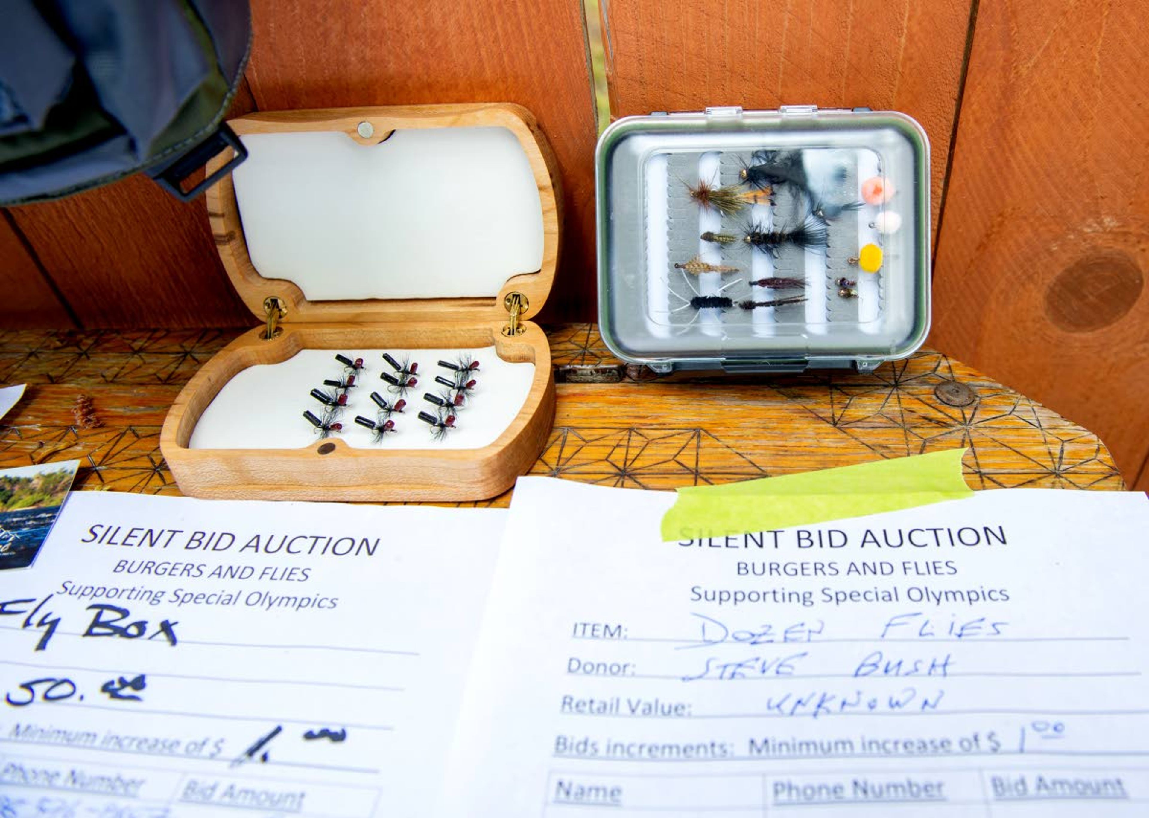 Handmade flies are auctioned off annually at the Burgers and Flies event in 2019. Joe McGurkin estimates the event has raised more than $150,000 for Moscow Special Olympics since 1978.