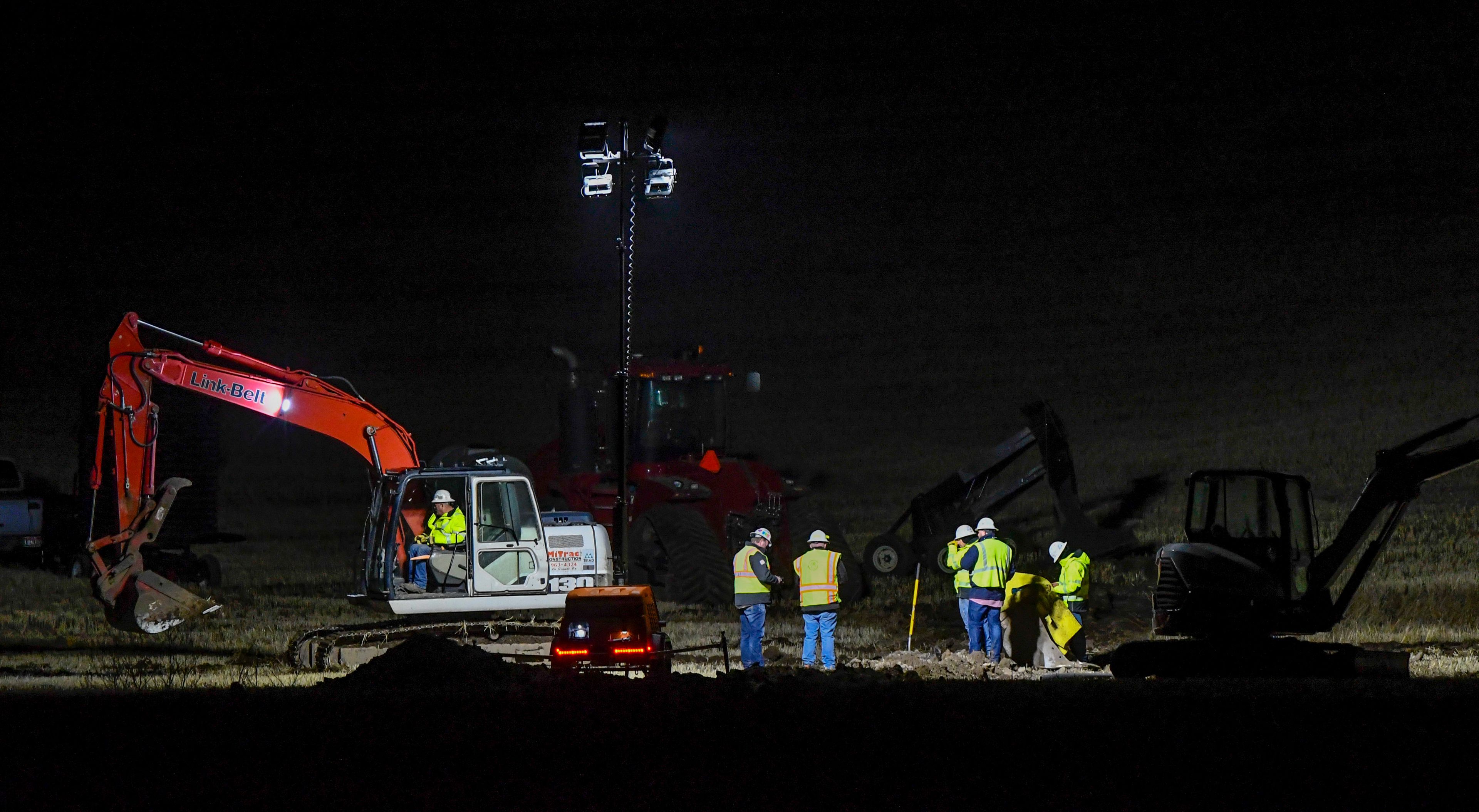 A crew works on a ruptured gas line along U.S. Highway 195 a few miles north of Pullman on Wednesday.