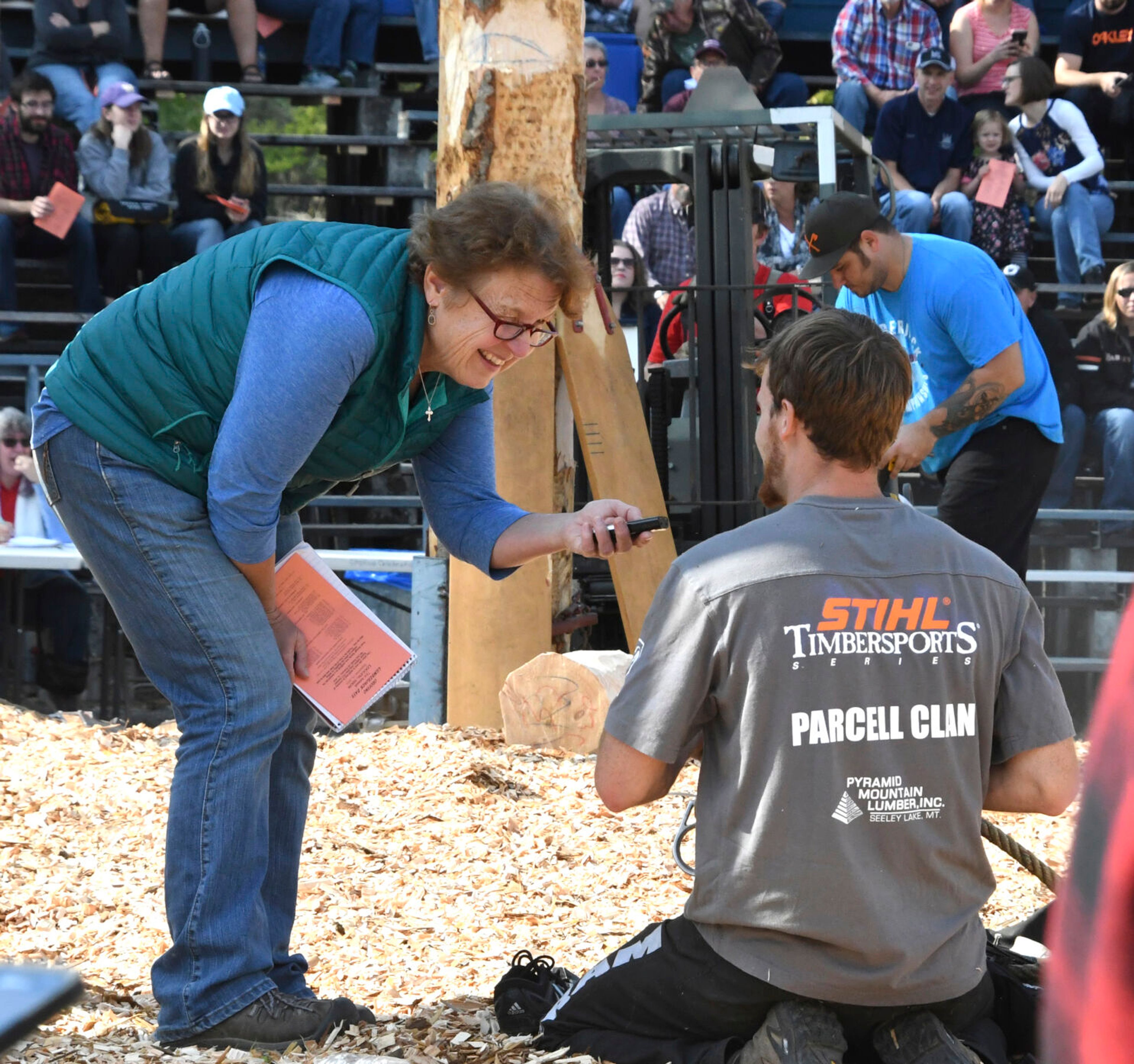 Kathy Hedberg interviews a competitior during Orofino Lumberjack Days.