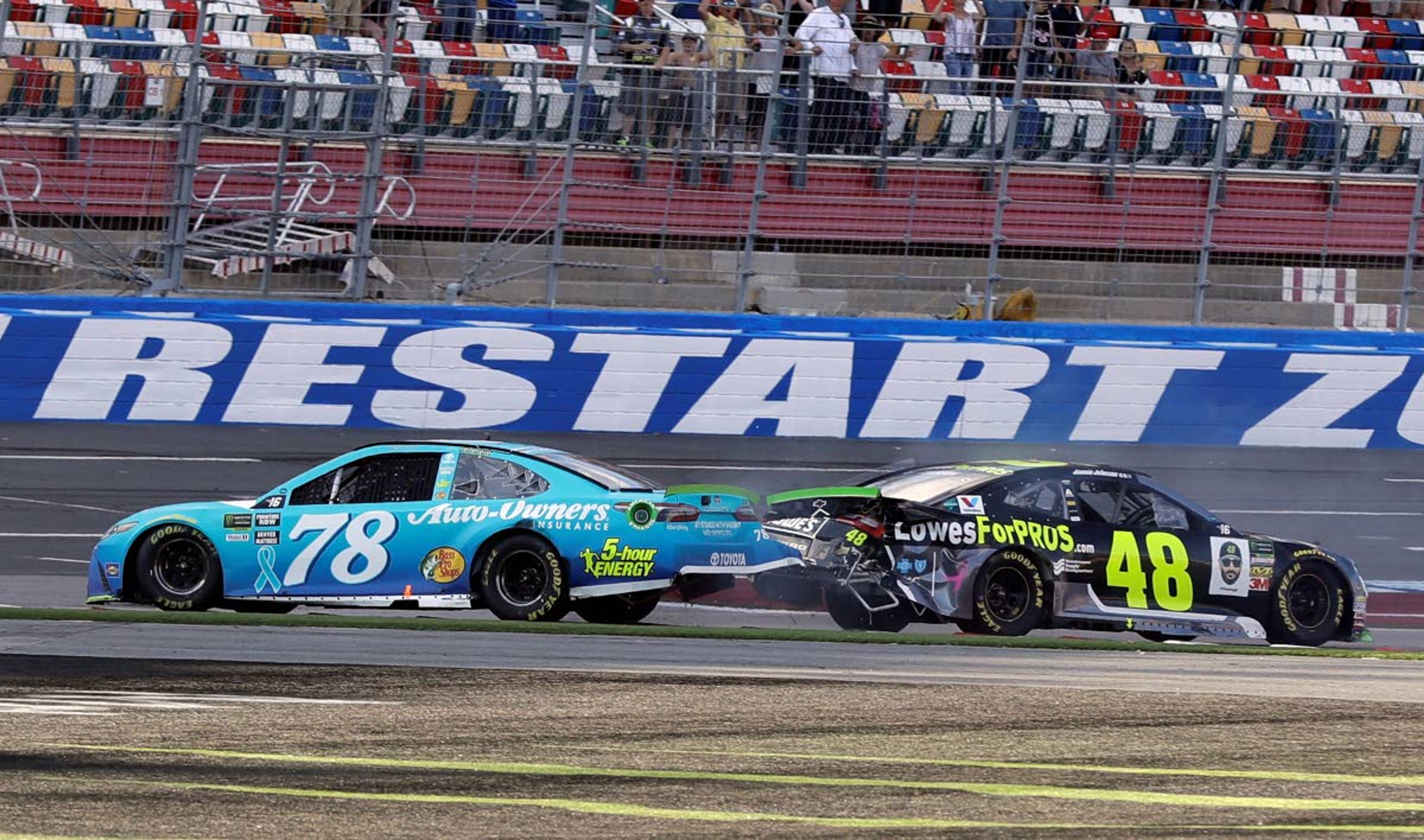 FILE - In this Sept. 30, 2018, file photo, Martin Truex Jr., (78) and Jimmie Johnson (48) crash on the final lap during the NASCAR Cup series auto race at Charlotte Motor Speedway in Concord, N.C. Charlotte Motor Speedway will host the Coca-Cola 600 on May 24, 2020, to mark 60 consecutive years the longest race on the NASCAR schedule will be held on Memorial Day weekend. The track in Concord will then host a Wednesday race three days later. (AP Photo/Chuck Burton, File)