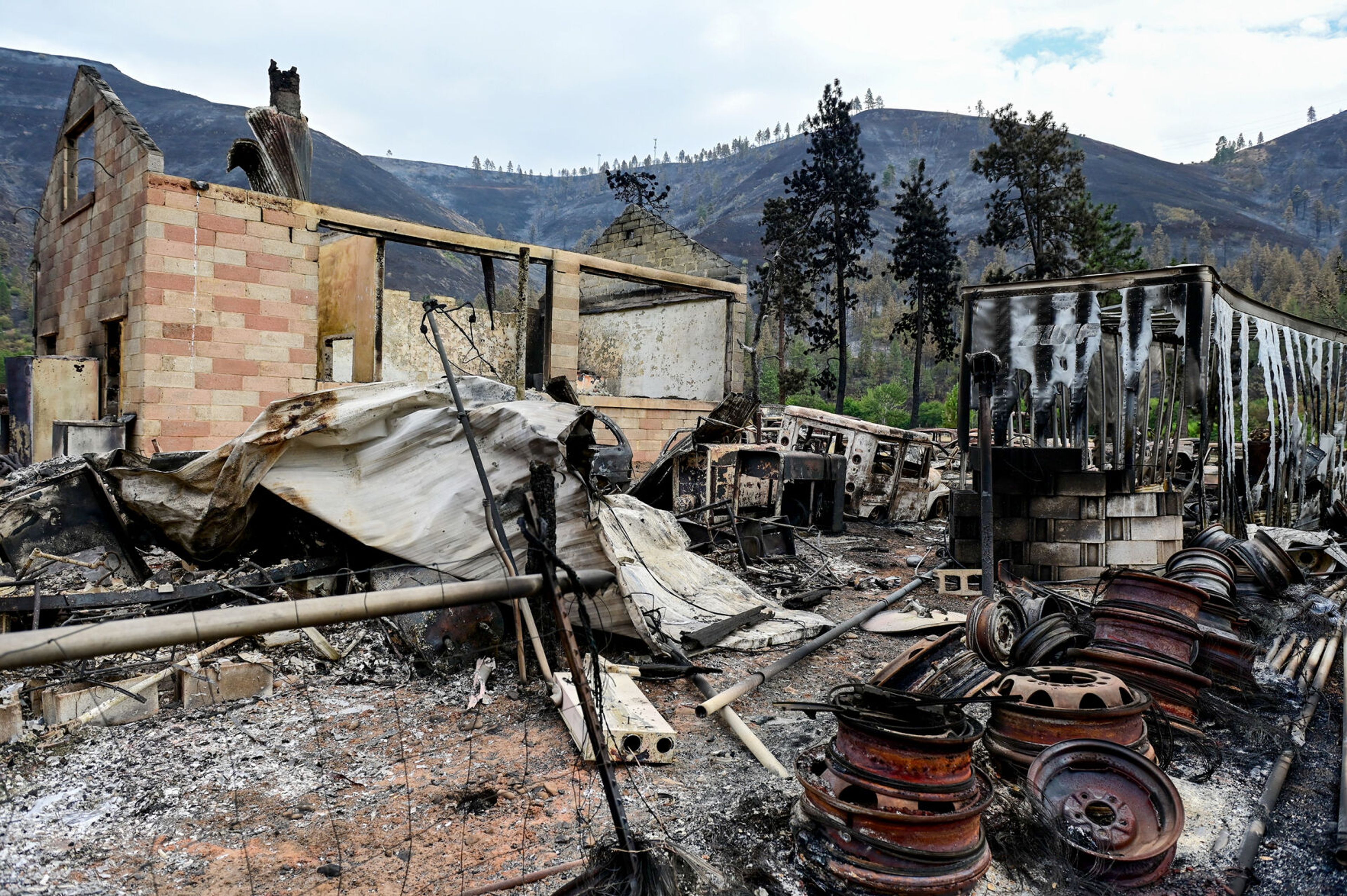 The historic Pilot Rock School is among the damage caused by the Gwen Fire to a property along Idaho Highway 3 in Juliaetta on Monday.