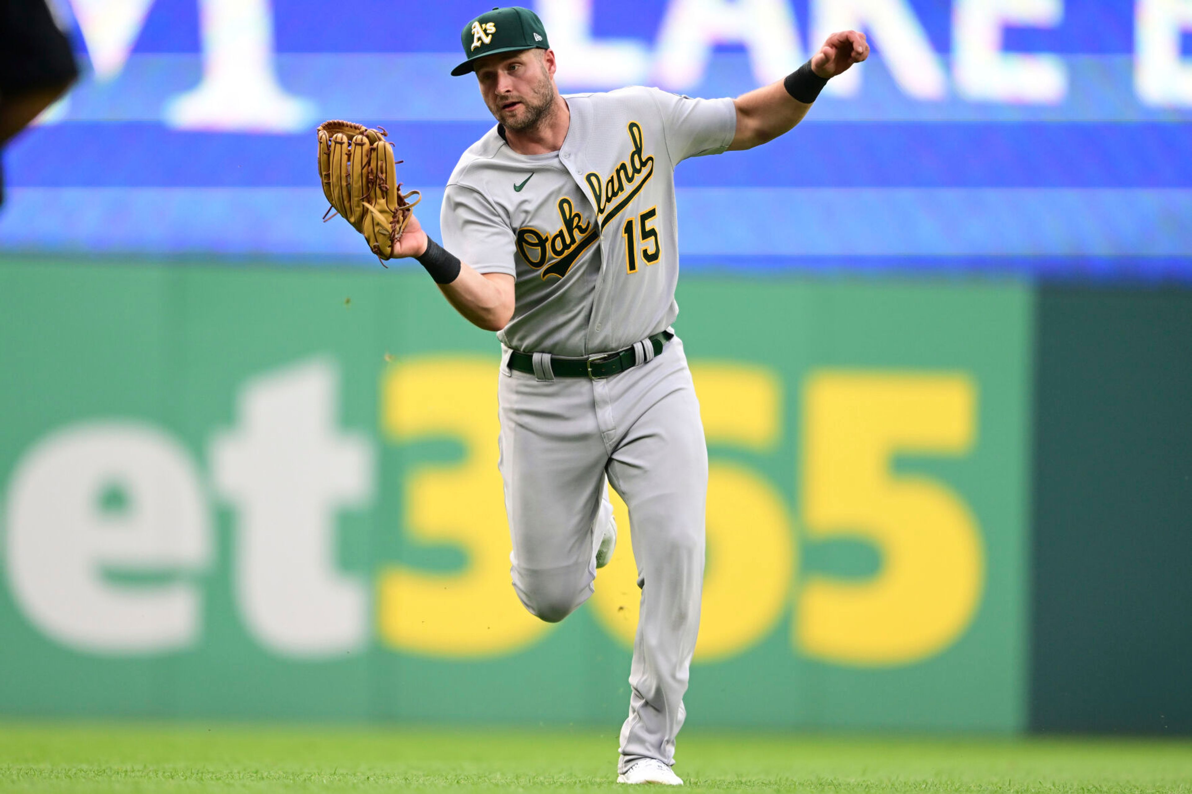 Oakland Athletics left fielder Seth Brown catches a ball hit by Cleveland Guardians' Bo Naylor during the fifth inning of a baseball game Tuesday, June 20, 2023, in Cleveland. (AP Photo/David Dermer)