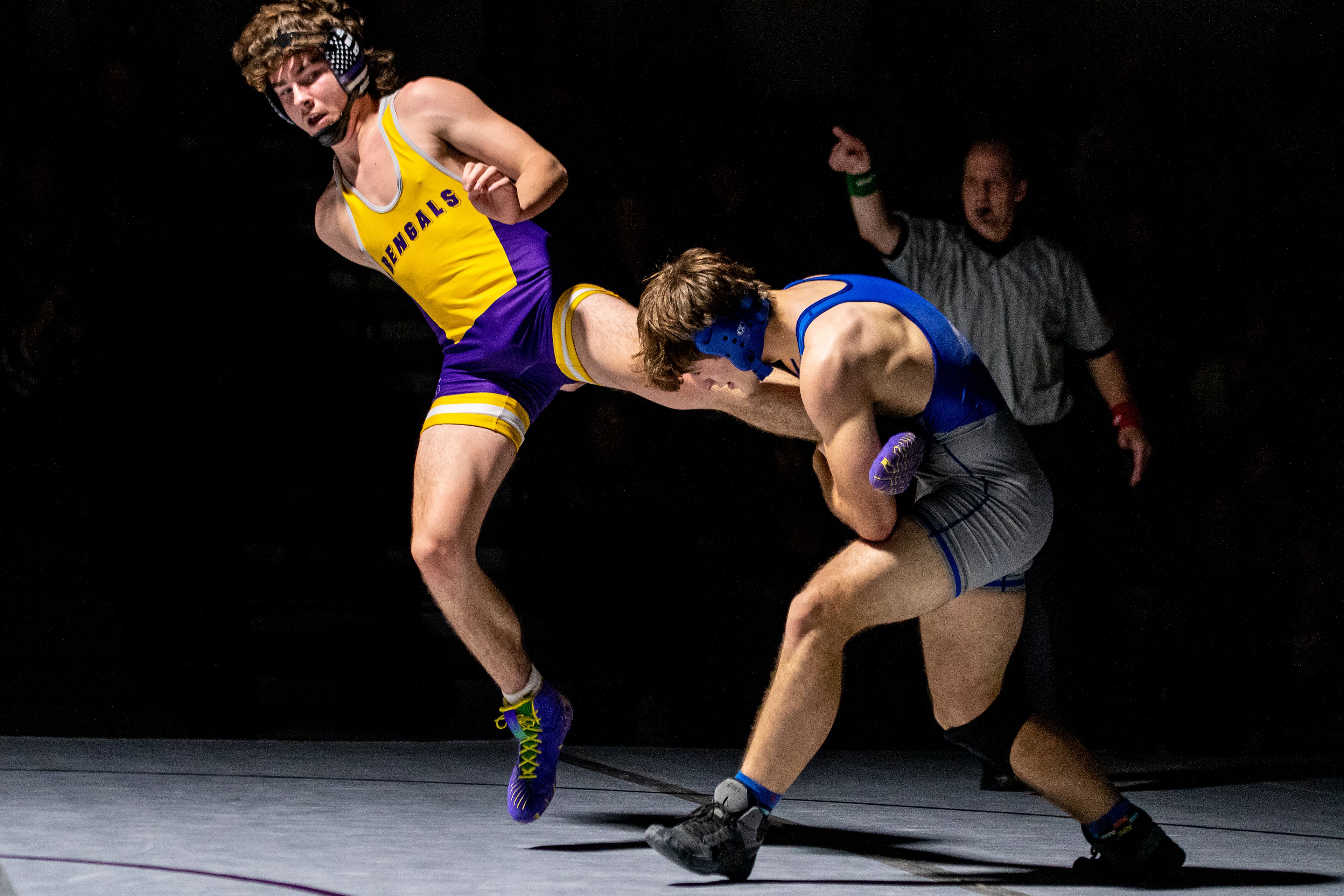 Pullman’s Merreck Emerson grapples with Lewiston’s Brice Cuthbert on Tuesday in the 182-pound weight class during a varsity wrestling match at Lewiston High.