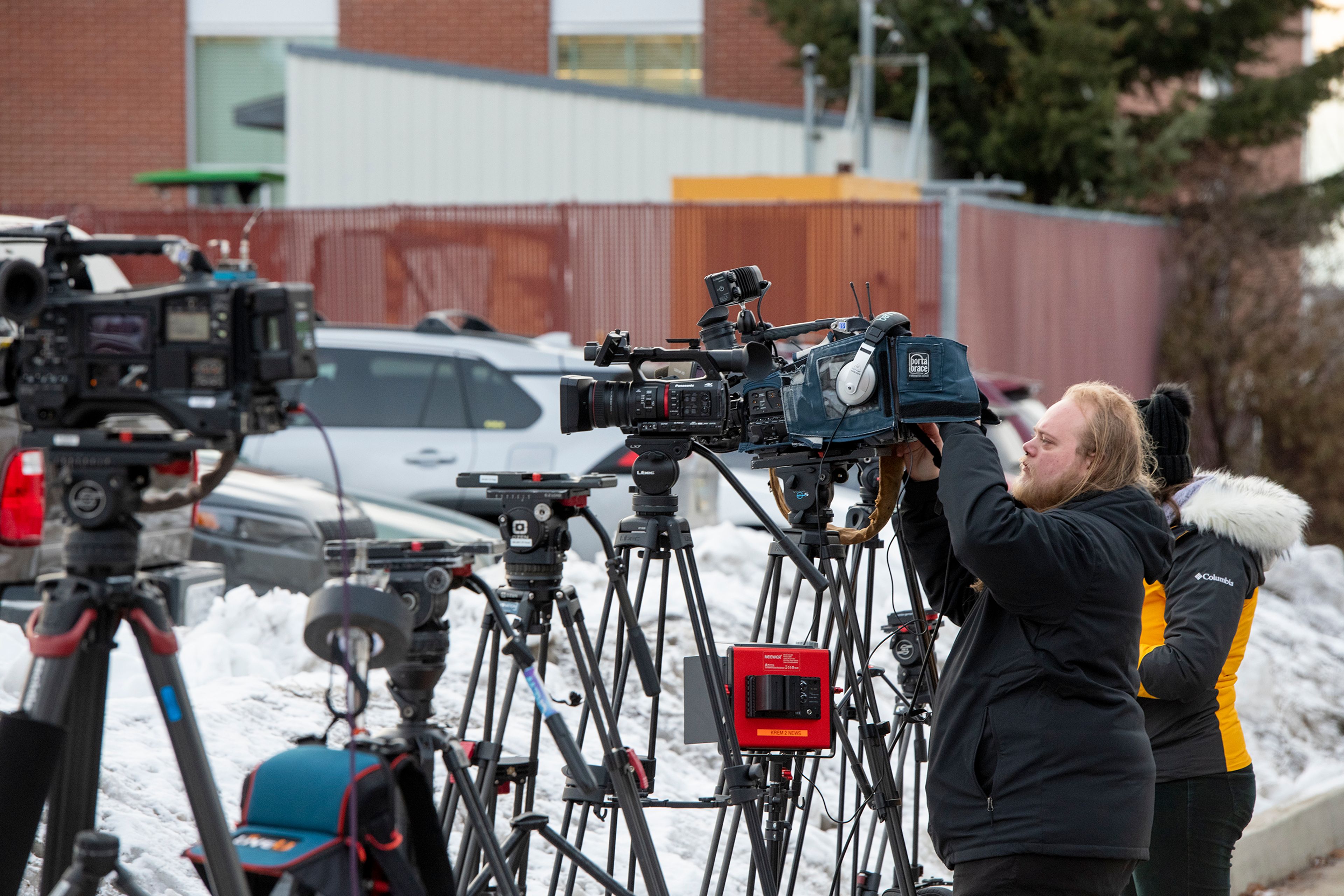 Media members setup cameras outside of the Latah County Jail as they wait for the arrival of Bryan Kohberger in Moscow on Wednesday. Kohberger is a suspect in a quadruple homicide case involving four University of Idaho students from Nov. 13.