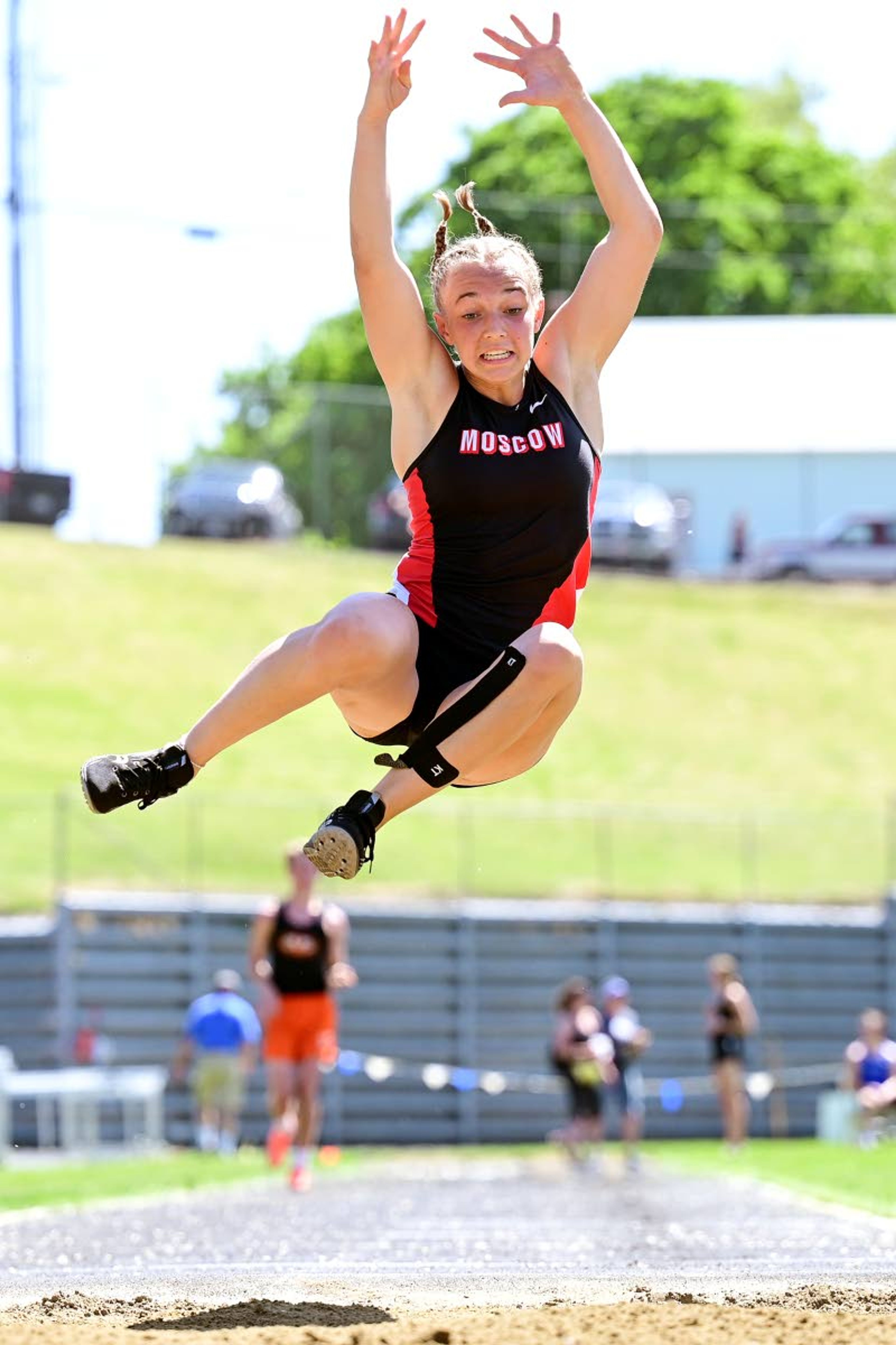 Moscow’s Skyla Zimmerman leaps into the air on her final long jump attempt Thursday afternoon at the District II Meet of Champions at Vollmer Bowl in Lewiston.