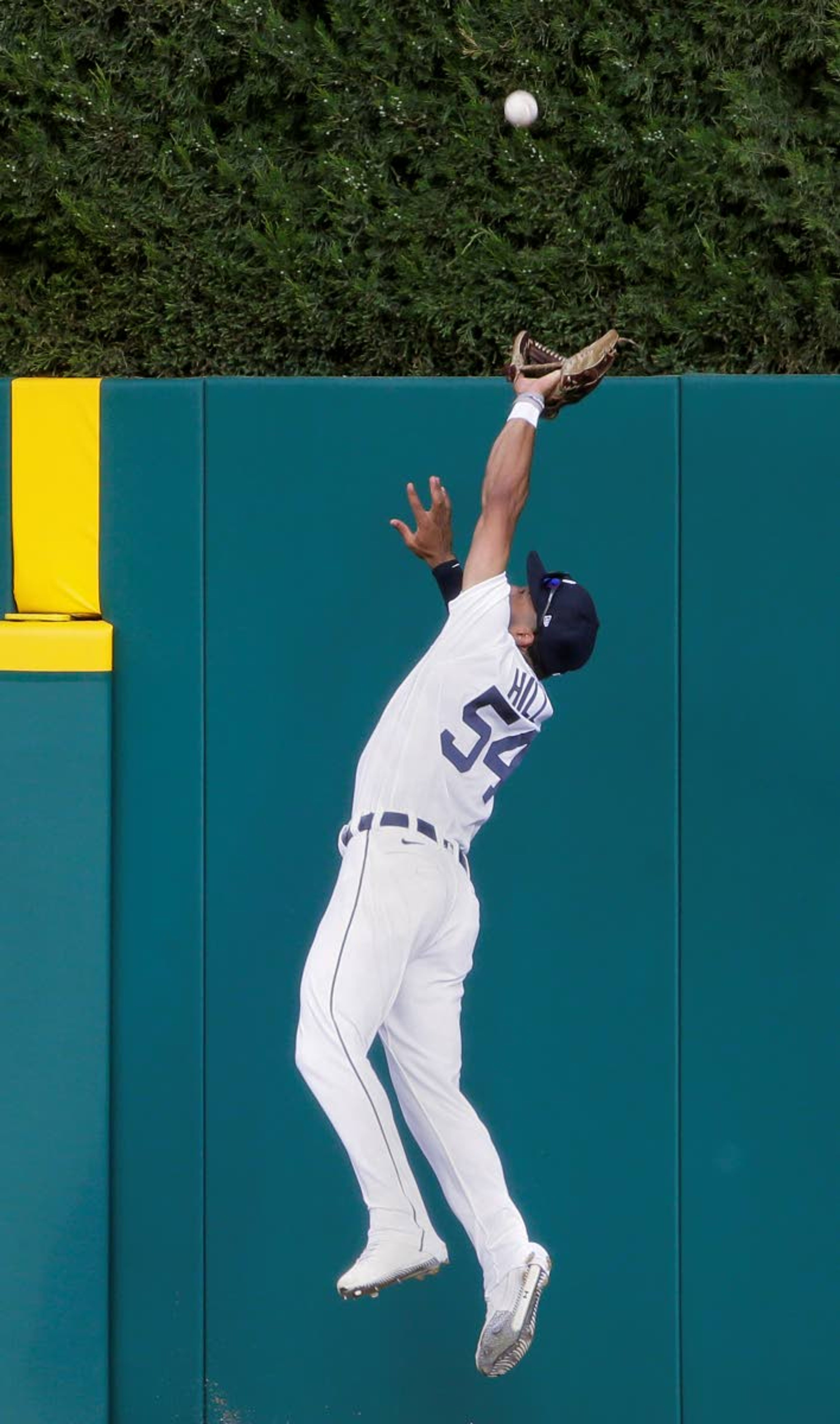 Detroit Tigers center fielder Derek Hill makes a leaping catch of a fly ball hit by Seattle Mariners' Kyle Seager during the first inning of a baseball game Wednesday, June 9, 2021, in Detroit. (AP Photo/Duane Burleson)