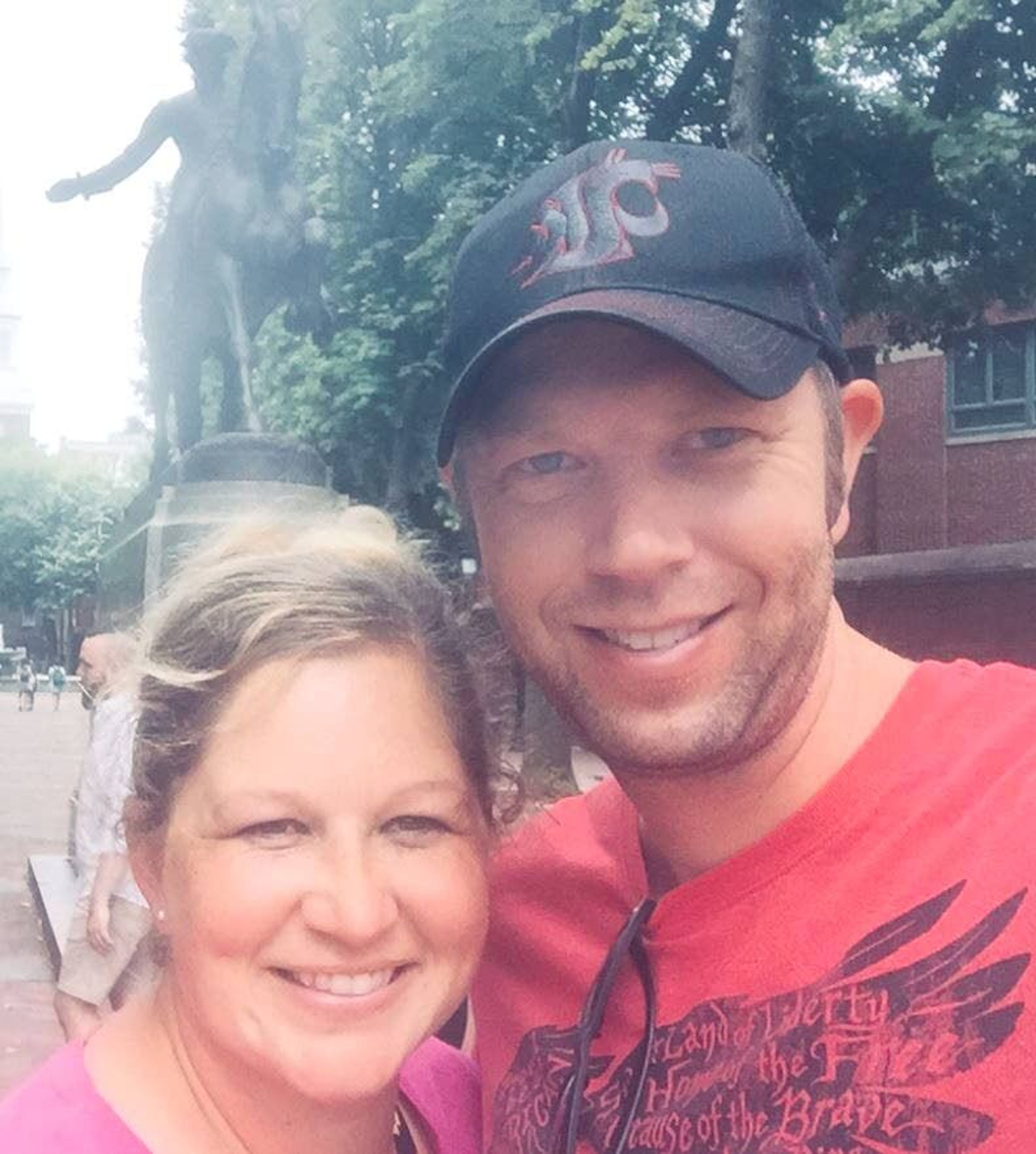 Colfax High School teachers Andrew and Ronda Penwell stand in front of a statue of Paul Revere in Boston.