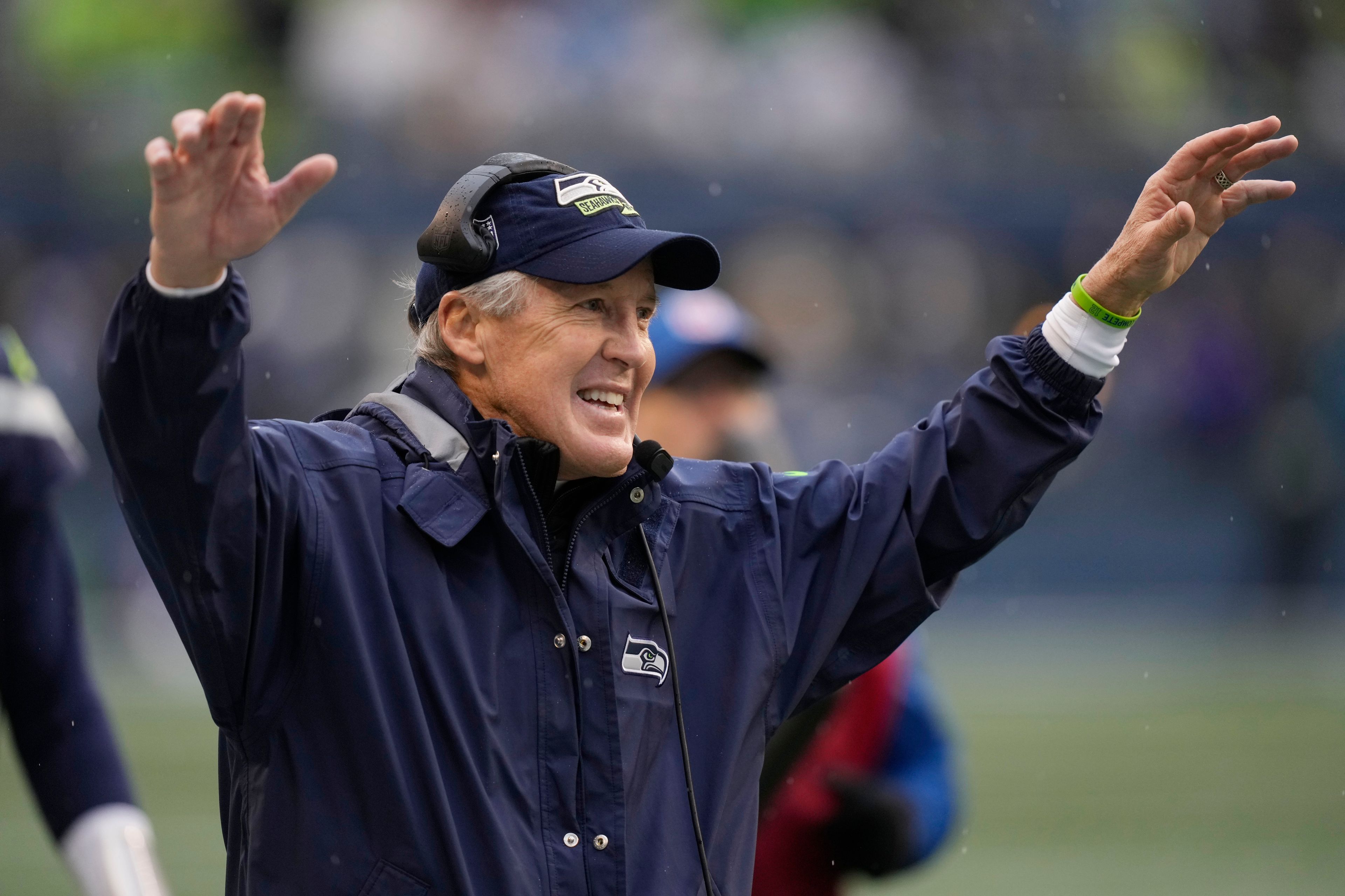 Seattle Seahawks head coach Pete Carroll celebrates after a touchdown catch by wide receiver Tyler Lockett during the second half of an NFL football game against the Los Angeles Rams Sunday, Jan. 8, 2023, in Seattle. (AP Photo/Stephen Brashear)