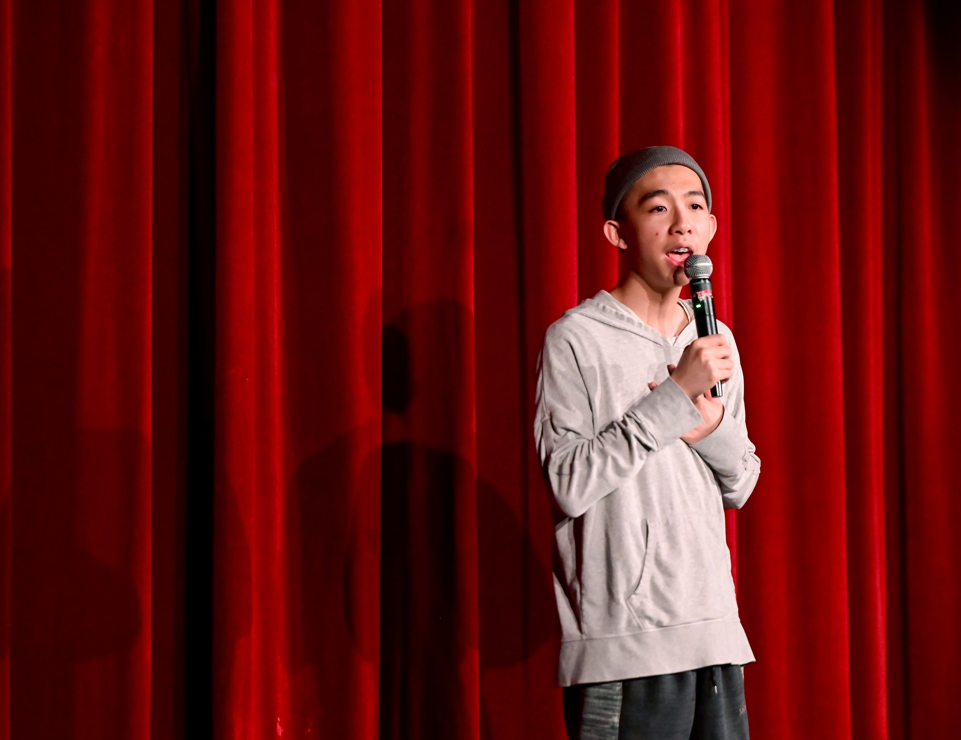 Charles Pan takes the stage to sing a song in Taiwanese during Moscow High School’s annual Arts Fest on Wednesday.