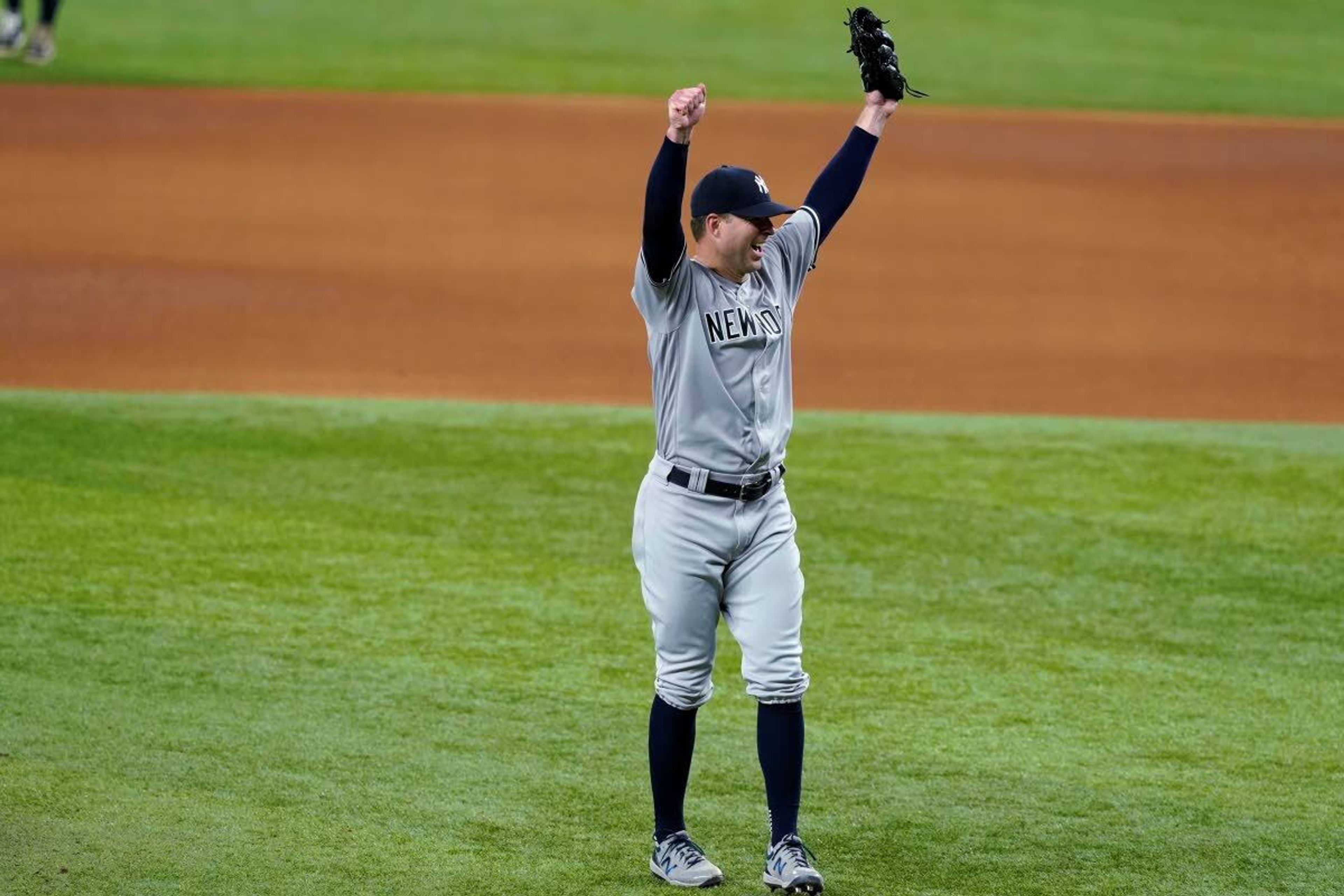 New York Yankees starting pitcher Corey Kluber celebrates after the final out by Texas Rangers' Willie Calhoun as Kluber threw a no-hitter in a baseball game in Arlington, Texas, Wednesday, May 19, 2021. (AP Photo/Tony Gutierrez)