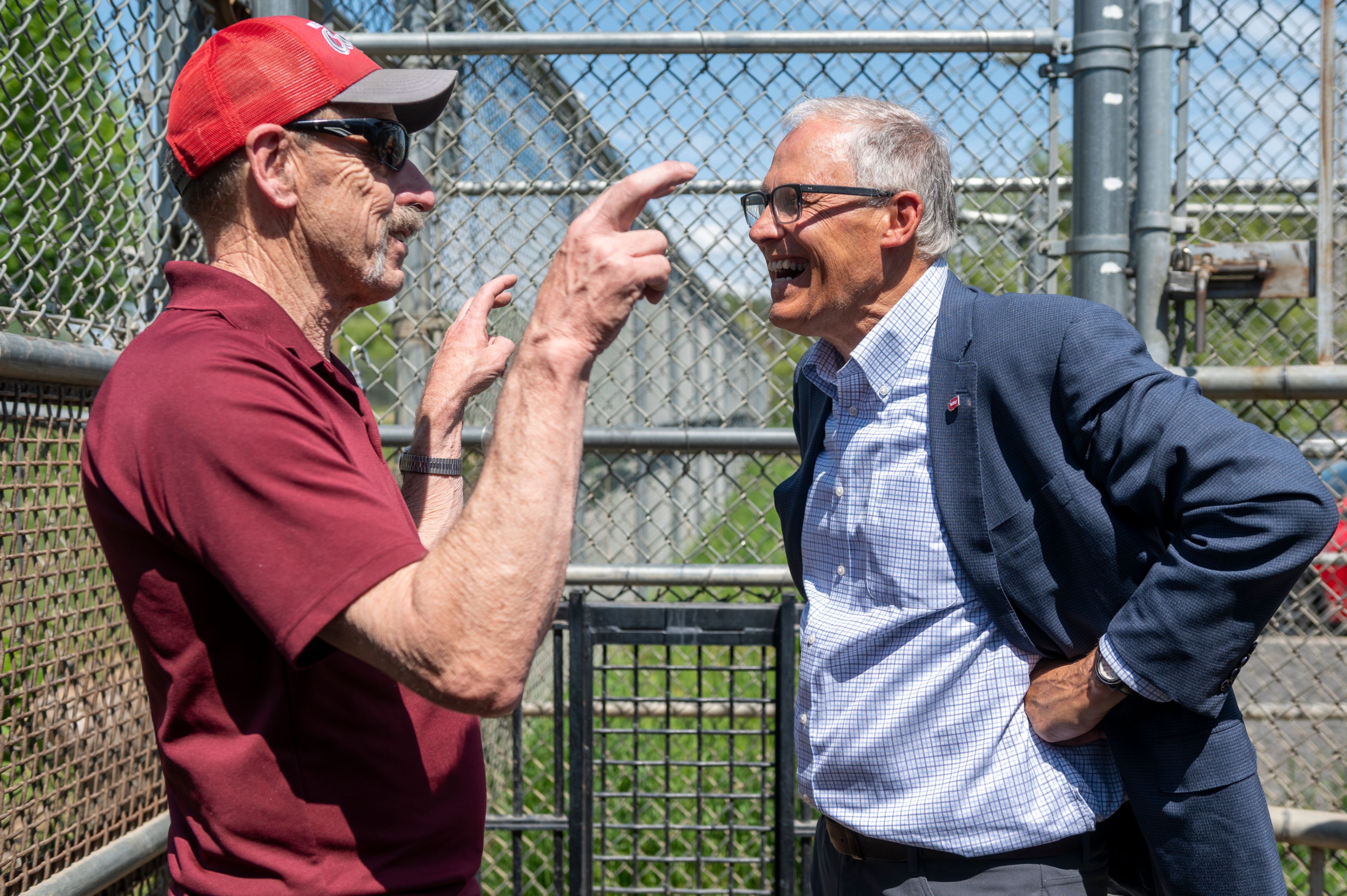 Washington Gov. Jay Inslee, right, speaks with professor Charlie Robbins while touring Washington State University’s Bear Center on Thursday afternoon in Pullman.