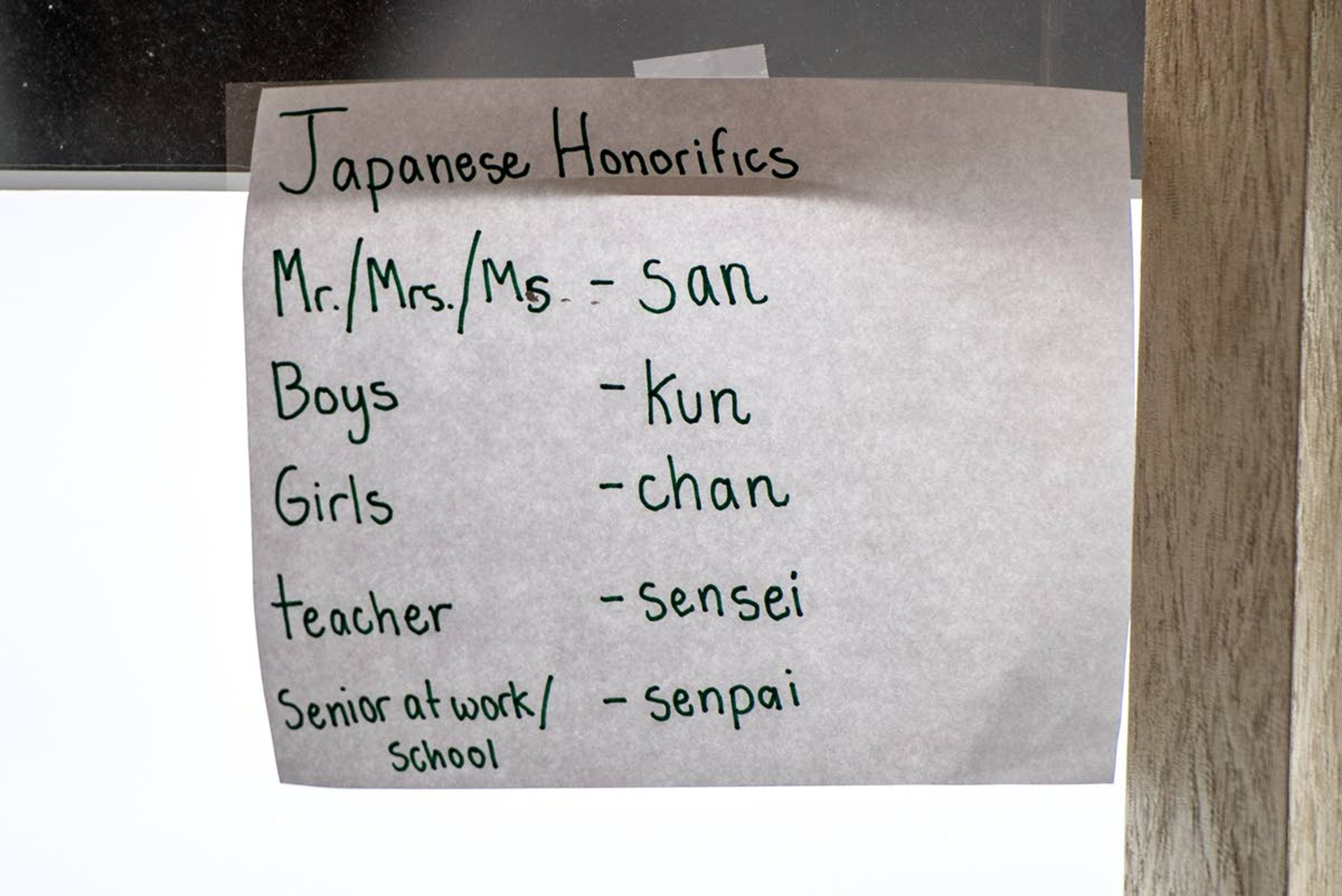 Japanese cheat sheets are taped to the window of Paradise Creek Regional High School in Moscow.