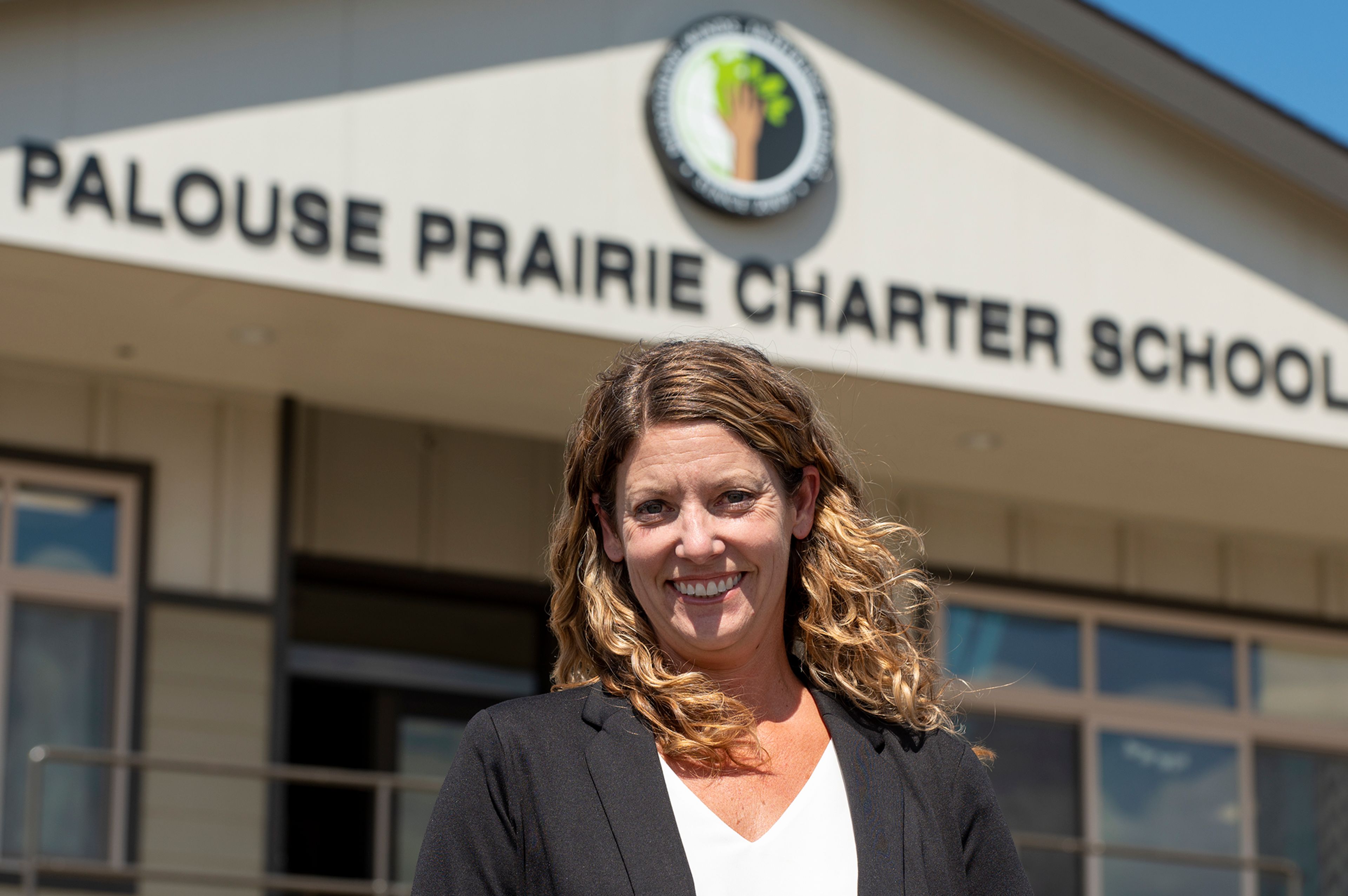 Executive director Sara Beggs stands in front of Palouse Prairie Charter School.