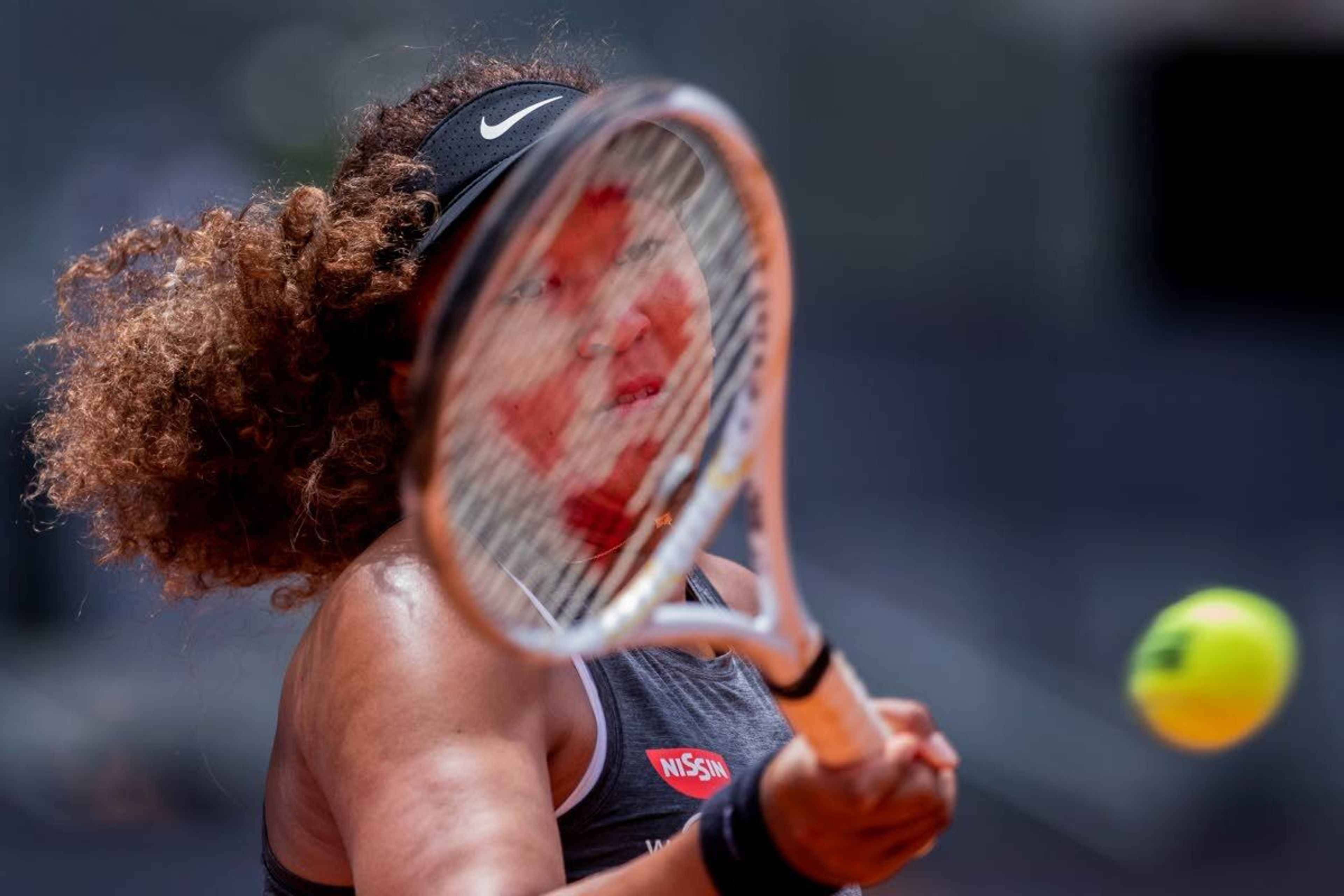 Japan's Naomi Osaka returns the ball to Japan's Misaki Doi during their match at the Mutua Madrid Open tennis tournament in Madrid, Spain, Friday, April 30, 2021. (AP Photo/Bernat Armangue)