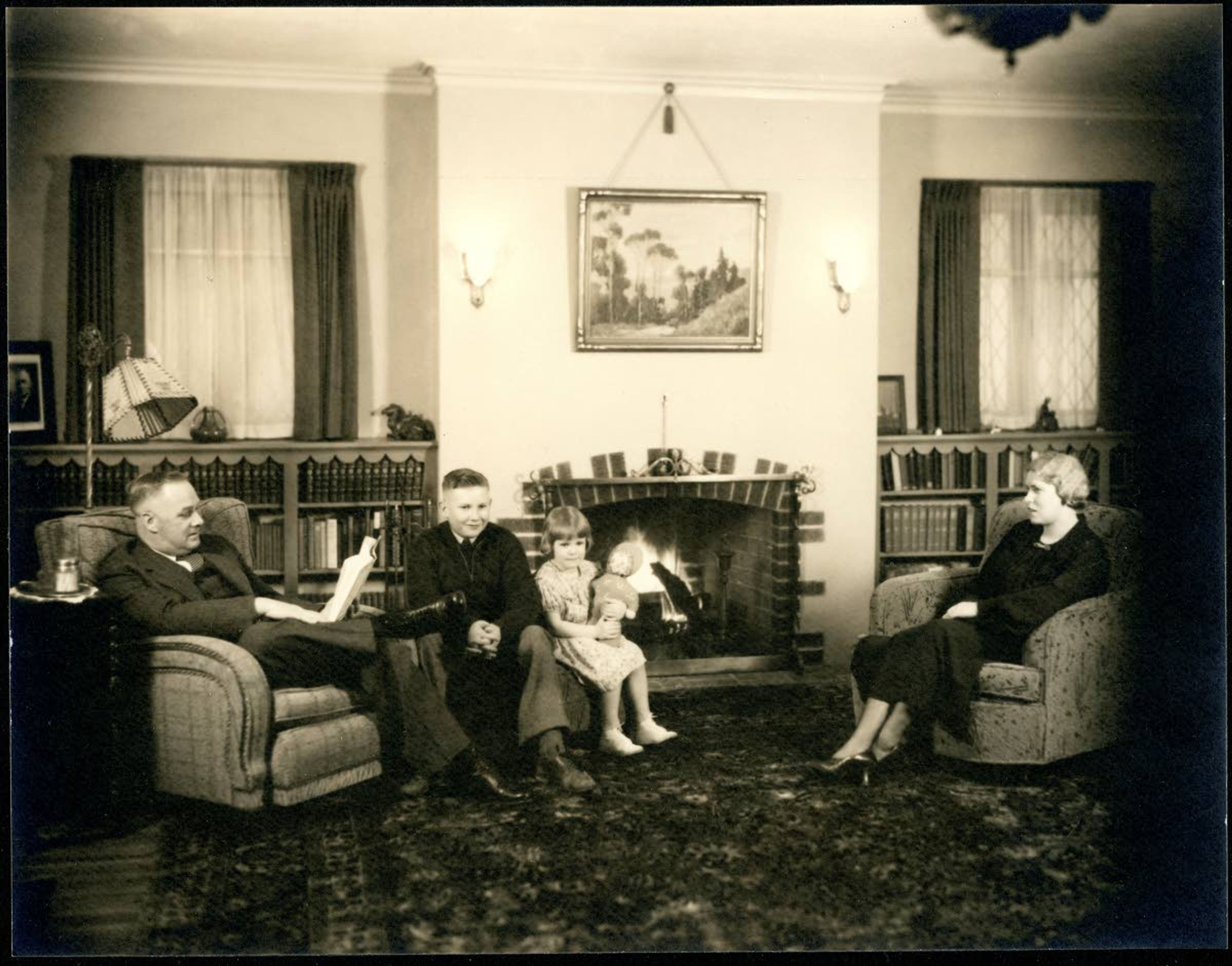 Frank Robinson was a masterful salesman. He called Psychiana “the advertised religion,” and made his happy Idaho life a central part of his pitch for students and subscribers. His son Alf, daughter Florence and wife, Pearl, are pictured with Robinson in the living room of their Howard Street home.