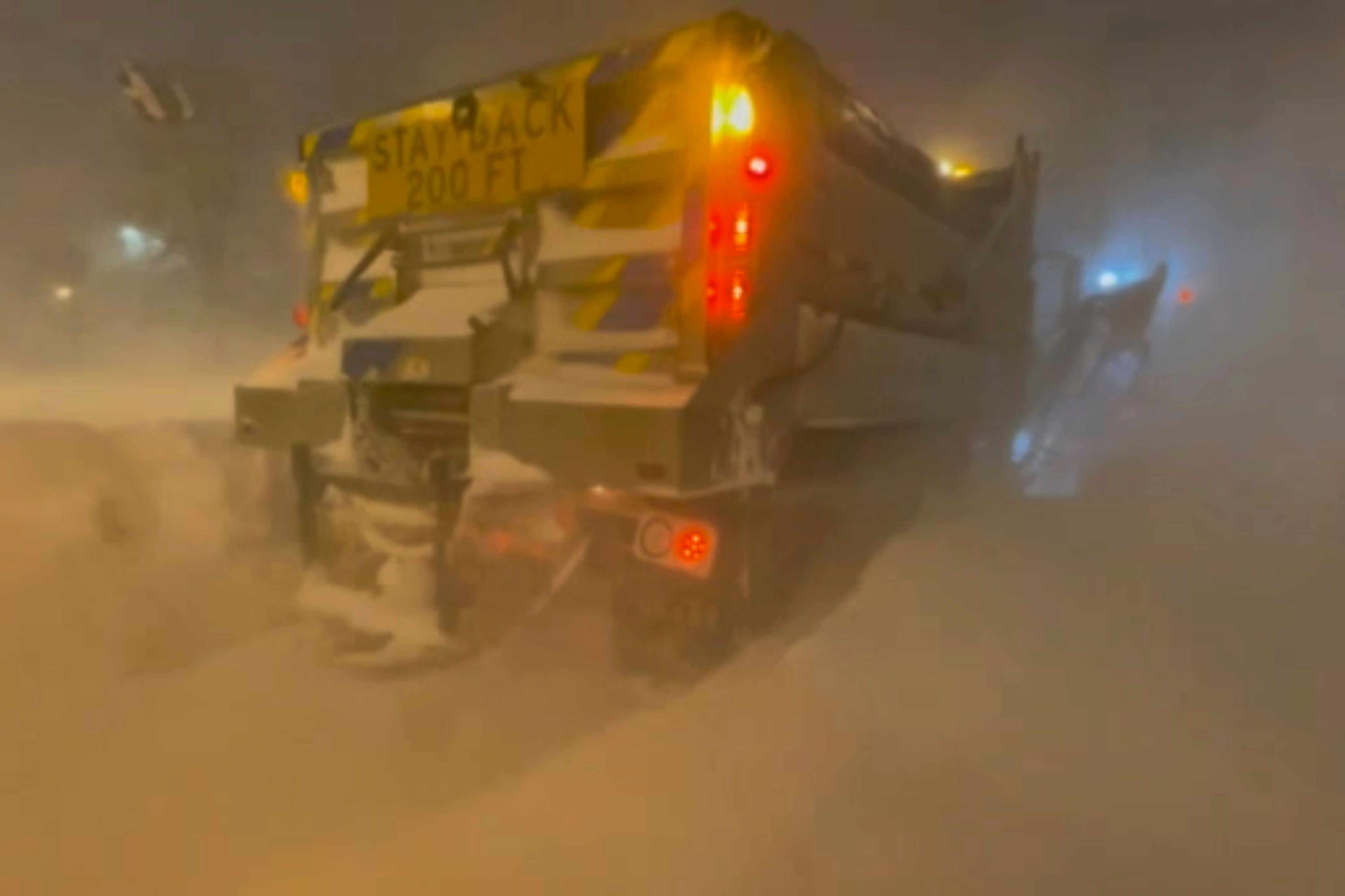 High winds and snow covers the streets and vehicles in Buffalo, N.Y. early Sunday, Dec. 25, 2022. Millions of people hunkered down in a deep freeze overnight and early morning to ride out the frigid storm that has killed at least 20 people across the United States, trapping some residents inside homes with heaping snow drifts and knocking out power to several hundred thousand homes and businesses.(WKBW via AP)