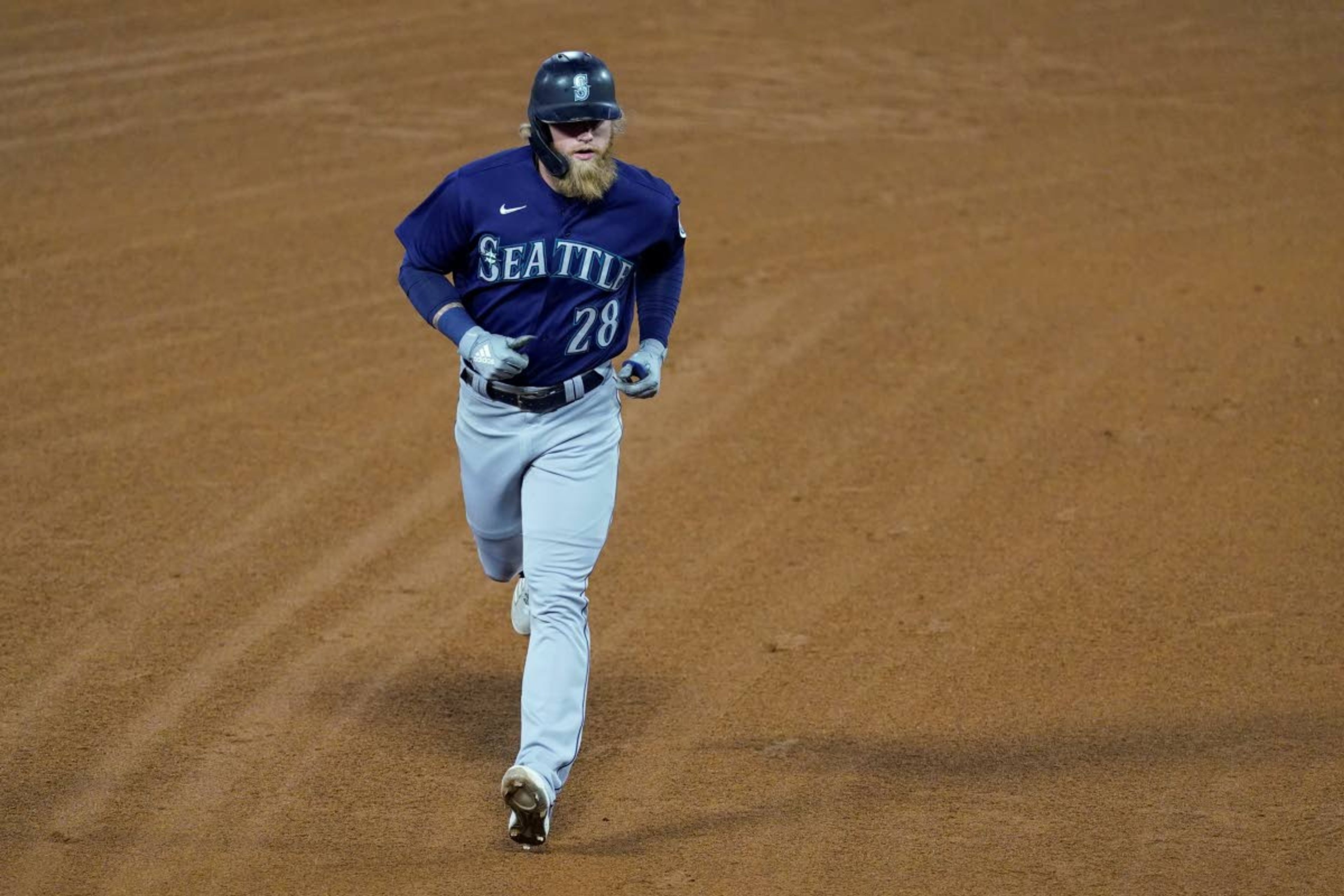 Seattle Mariners designated hitter Jake Fraley (28) runs the bases after hitting a grand slam home run during the fourth inning of a baseball game against the Los Angeles Angels Saturday, June 5, 2021, in Anaheim, Calif. Mitch Haniger, Ty France, and Taylor Trammell also scored. (AP Photo/Ashley Landis)