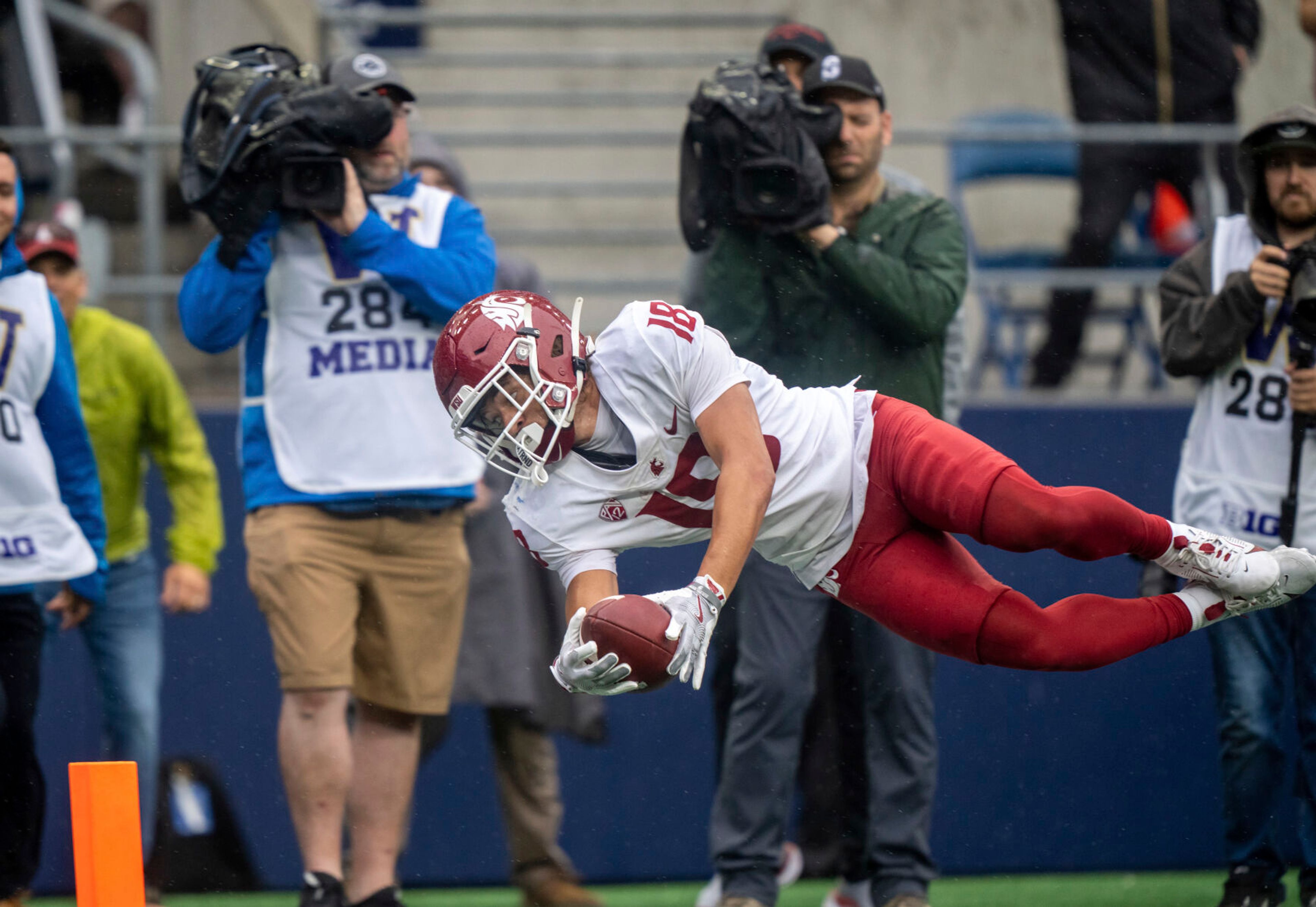 Washington State wide receiver Josh Meredith dives for a touchdown during the second half of an NCAA football game against Washington on Saturday, Sept. 14, 2024, in Seattle. Washington State won 24-19. (AP Photo/Stephen Brashear)