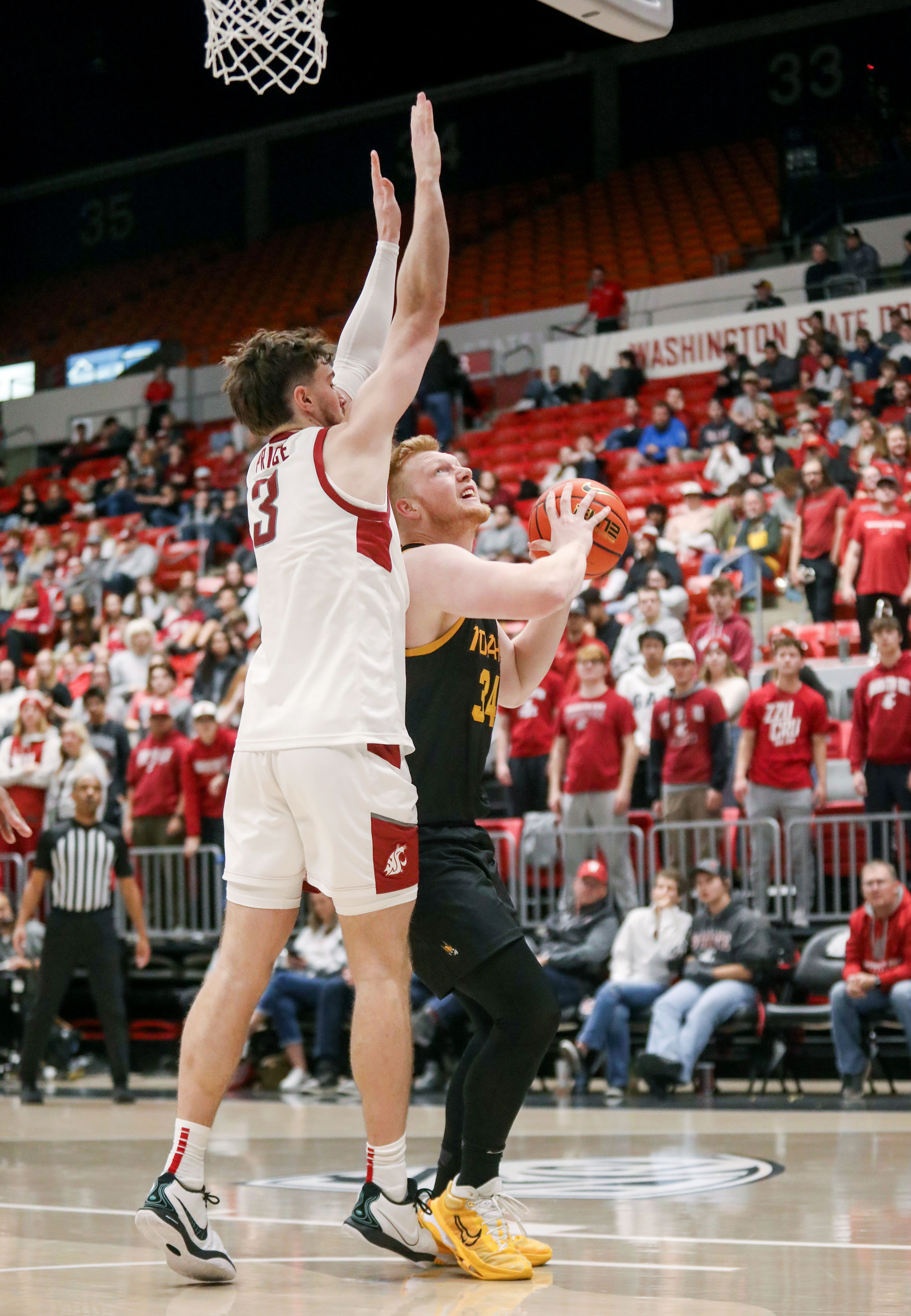 Washington State forward Ethan Price guards Idaho forward Kyson Rose under the net Monday during the Battle of the Palouse game at Beasley Coliseum in Pullman.