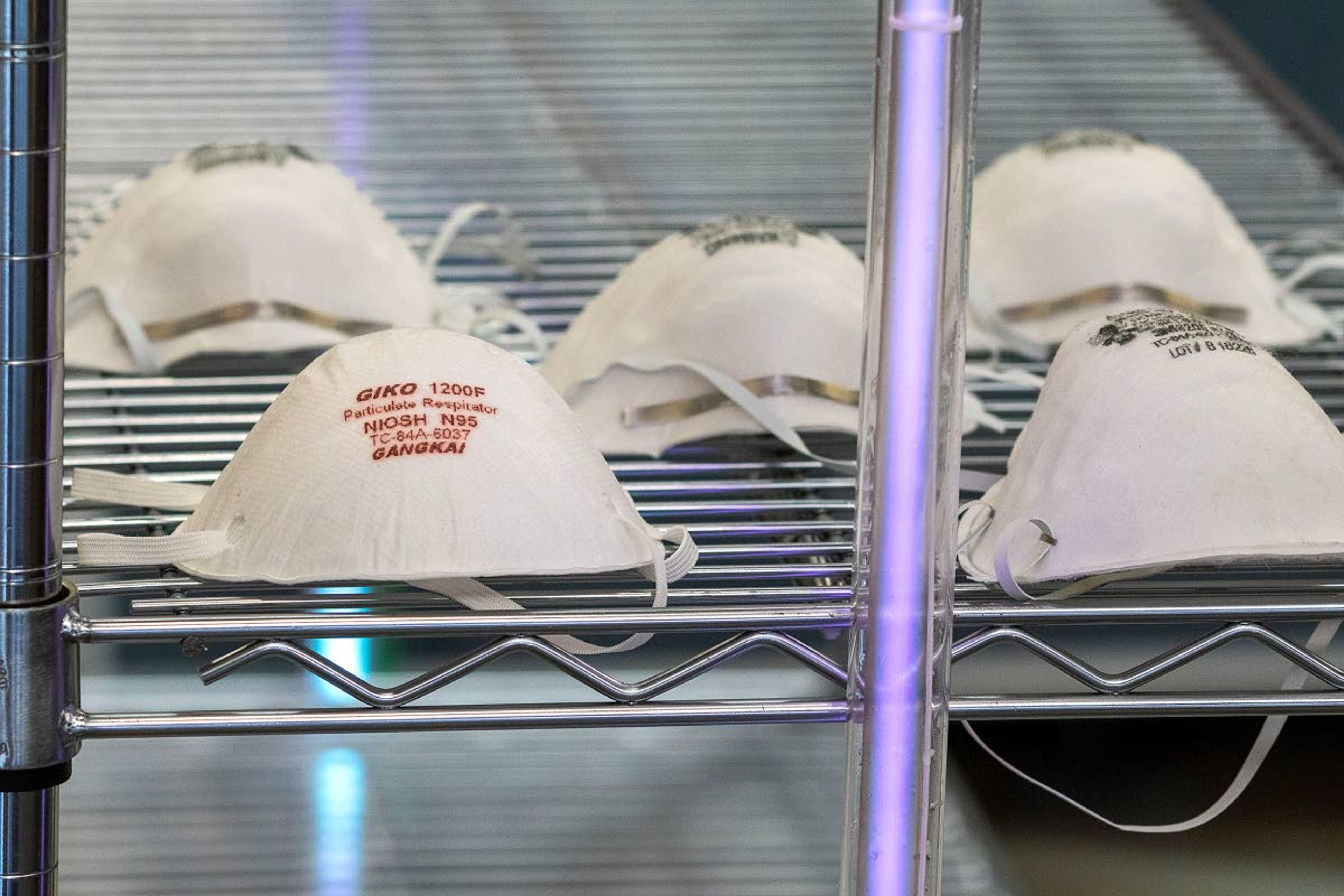 Engineers at the lab built cabinets that use ultraviolet light to sterilize face masks and other medical equipment in about 15 minutes. One of two UV-C tubes used in the cabinet is seen here.