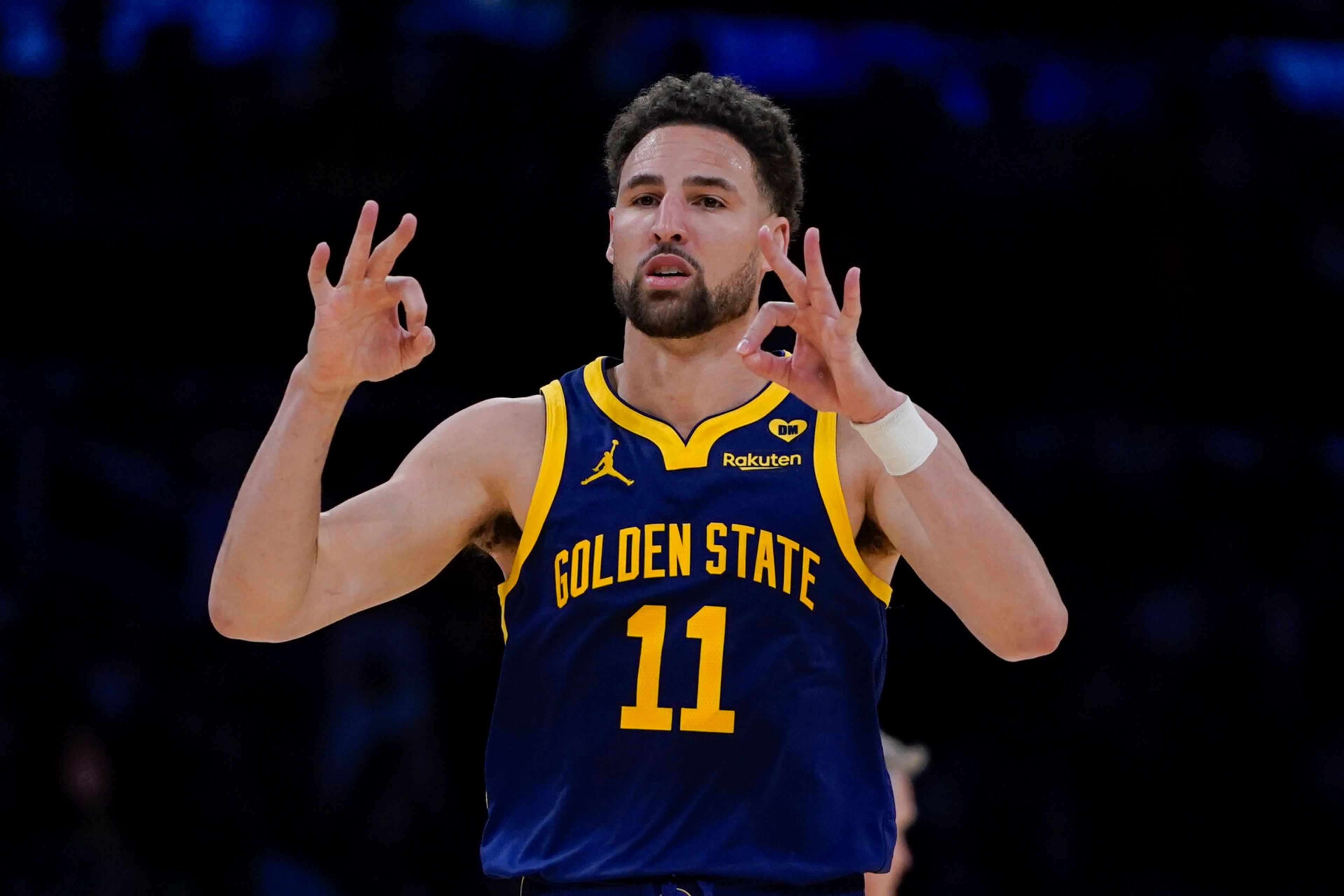 FILE - Golden State Warriors guard Klay Thompson gestures after making a 3-point basket against the Los Angeles Lakers during the second half of an NBA basketball game Tuesday, April 9, 2024, in Los Angeles. Klay Thompson is moving on from the Golden State Warriors, with the four-time league champion agreeing to join the Western Conference champion Dallas Mavericks and change franchises for the first time in his 13-year NBA career, two people with knowledge of the decision said Monday, July 1, 2024.(AP Photo/Ryan Sun)