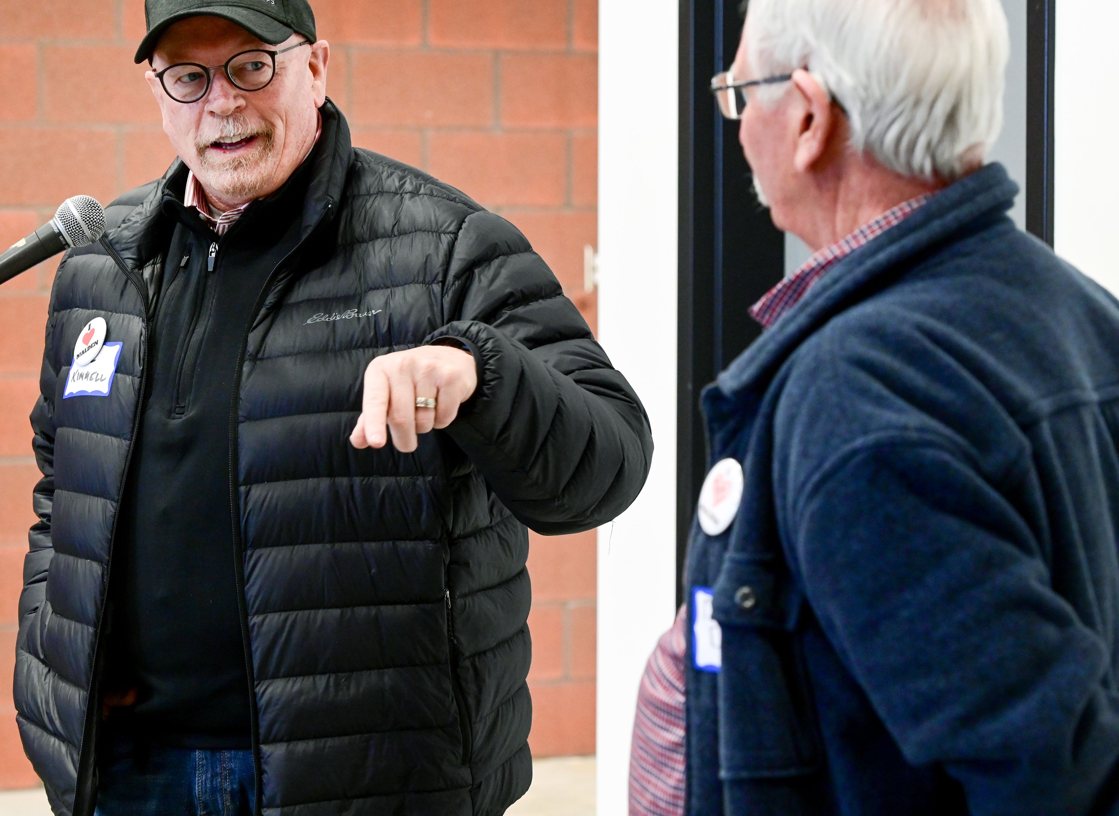 Paul Kimmell, left, Palouse area regional business manager with Avista Corporation, looks at Malden Mayor Dan Harwood as he promises a continued commitment to the town at the ribbon cutting on Thursday.