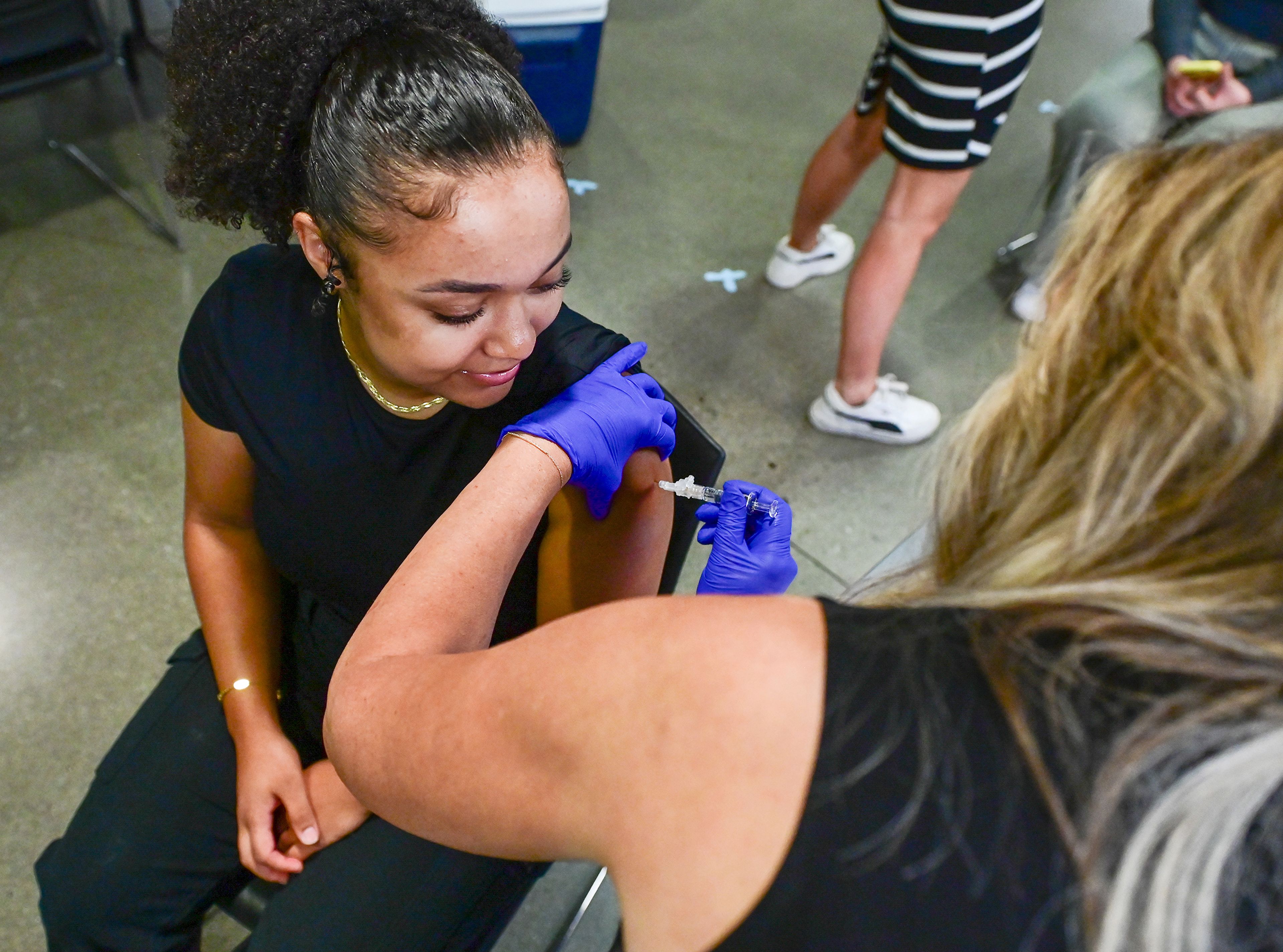 Sierra Rowe, left, a Washington State University student and secretary of the Student Health Advisory Council with Cougar Health Services, receives a flu vaccine Friday from Chris Boyd, manager of Nursing Services at Cougar Health Services, at the Flu Shot Friday clinic on campus in Pullman.