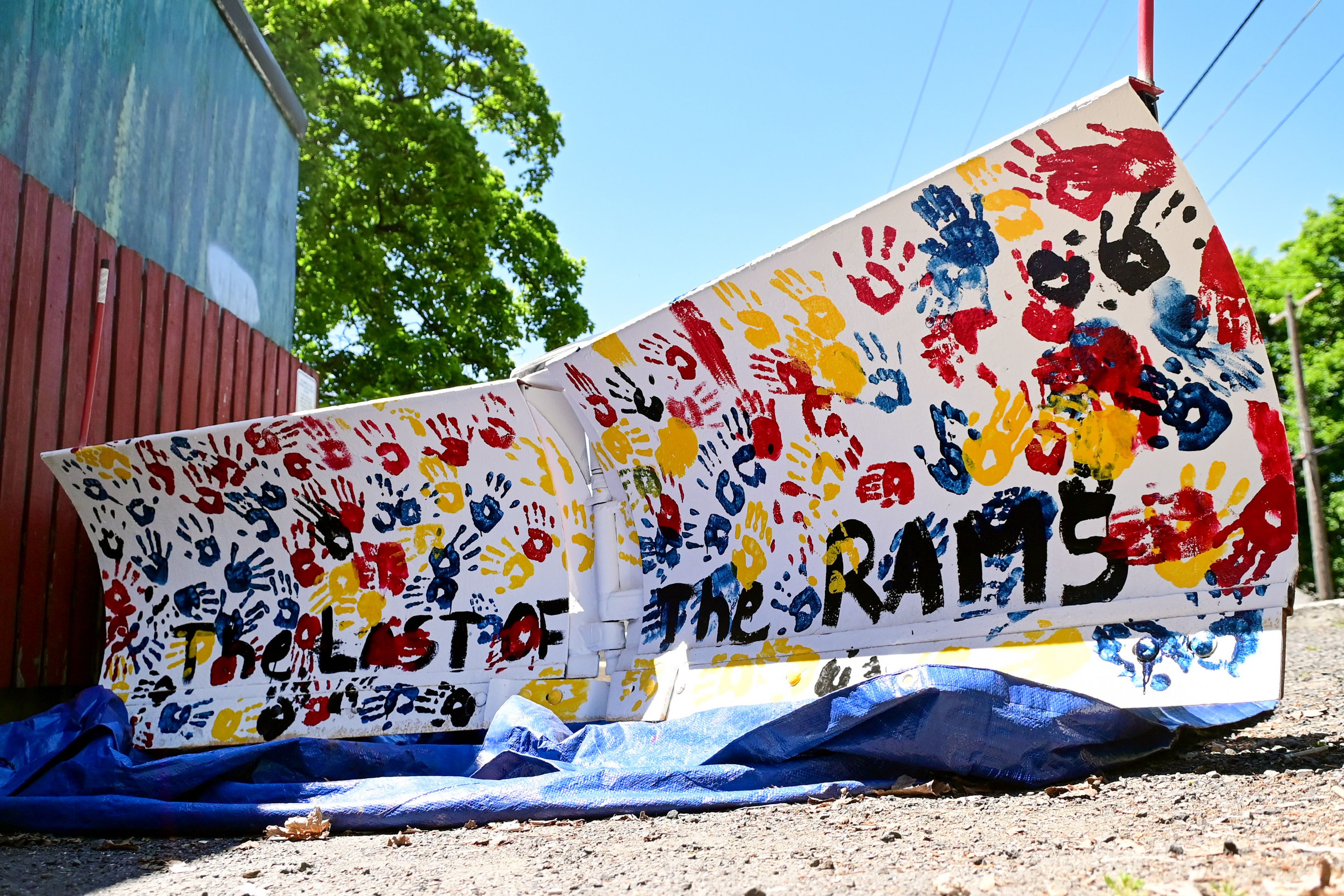 A snow plow decorated with hand prints of Russell Elementary students sits outside the school on Thursday, a day after the school’s final last day of school. The artwork is part of a city of Moscow initiative with Moscow School District and will be utilized in the upcoming winter.