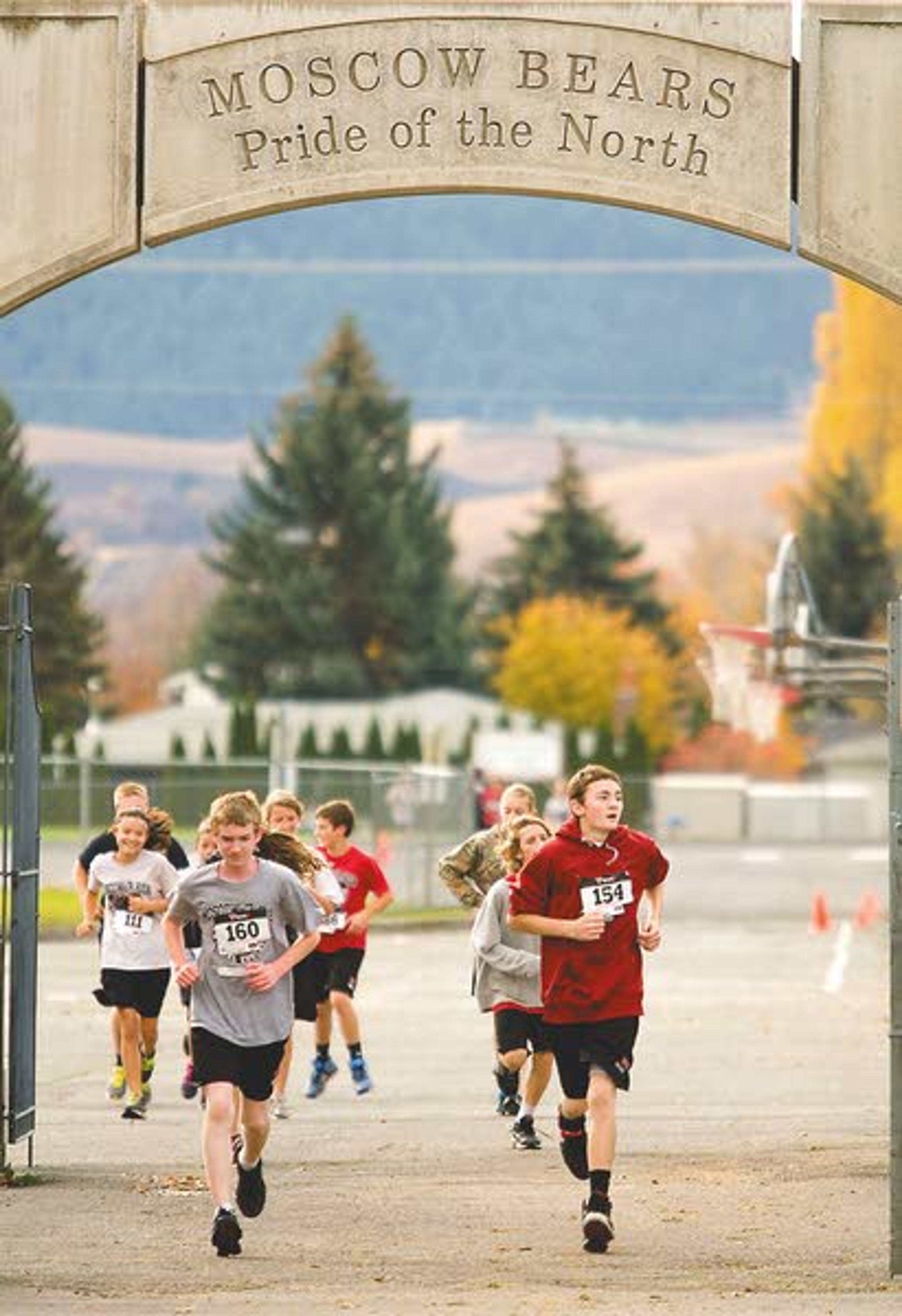 Seventh-graders and their parents run in the second annual Fun Run at Moscow Middle School on Monday. The run was 1.2 miles long and was part of a cumulative half-marathon.