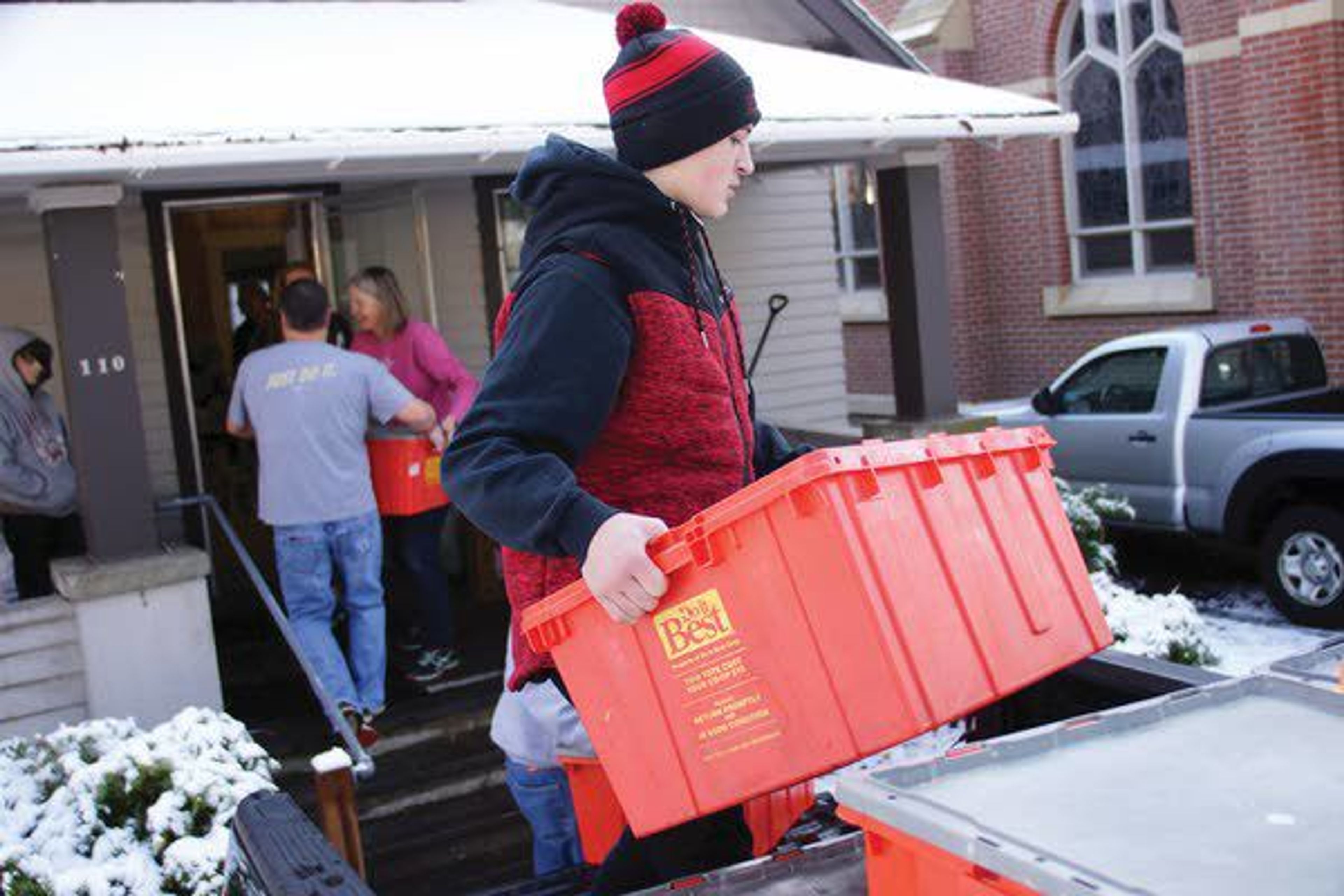 Michael Kiblen unloads crates of food Saturday at the Moscow Food Bank during the 13th annual Palouse Cares Food Drive and Auctions.