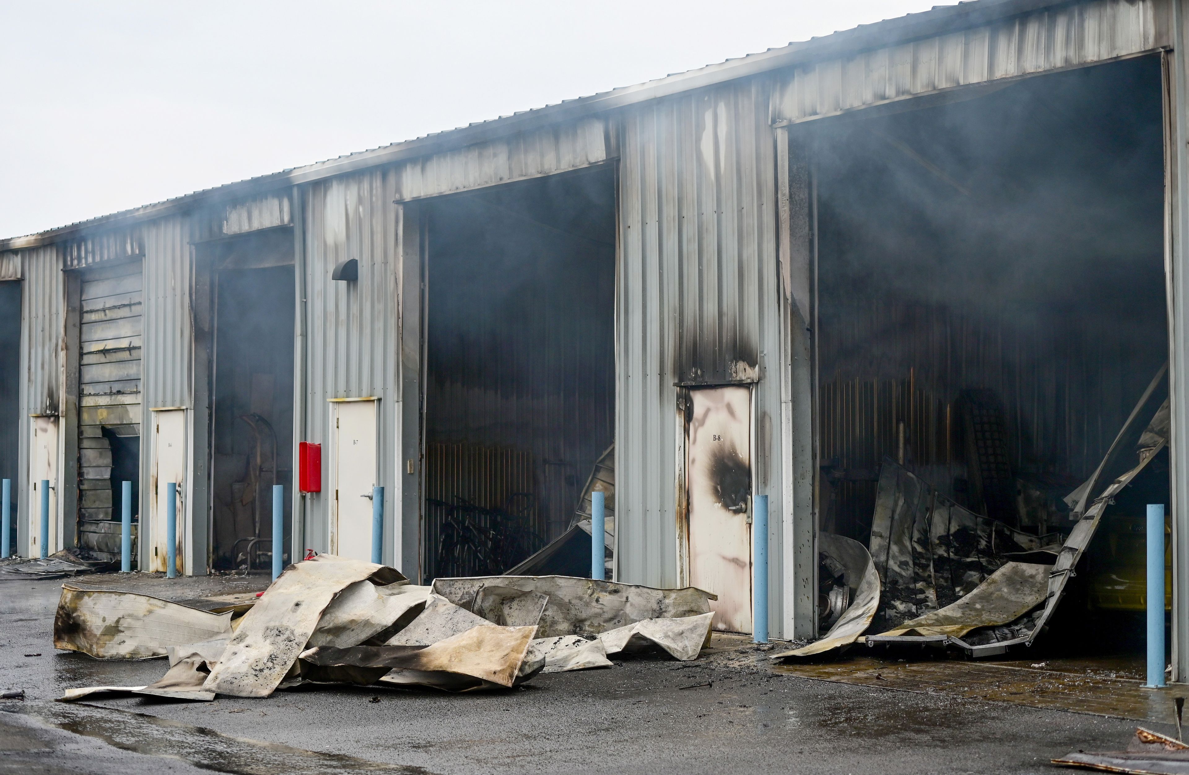 Garage doors lay along the ground in the aftermath of large fire at Express Storage along Moscow-Pullman Highway on Thursday.