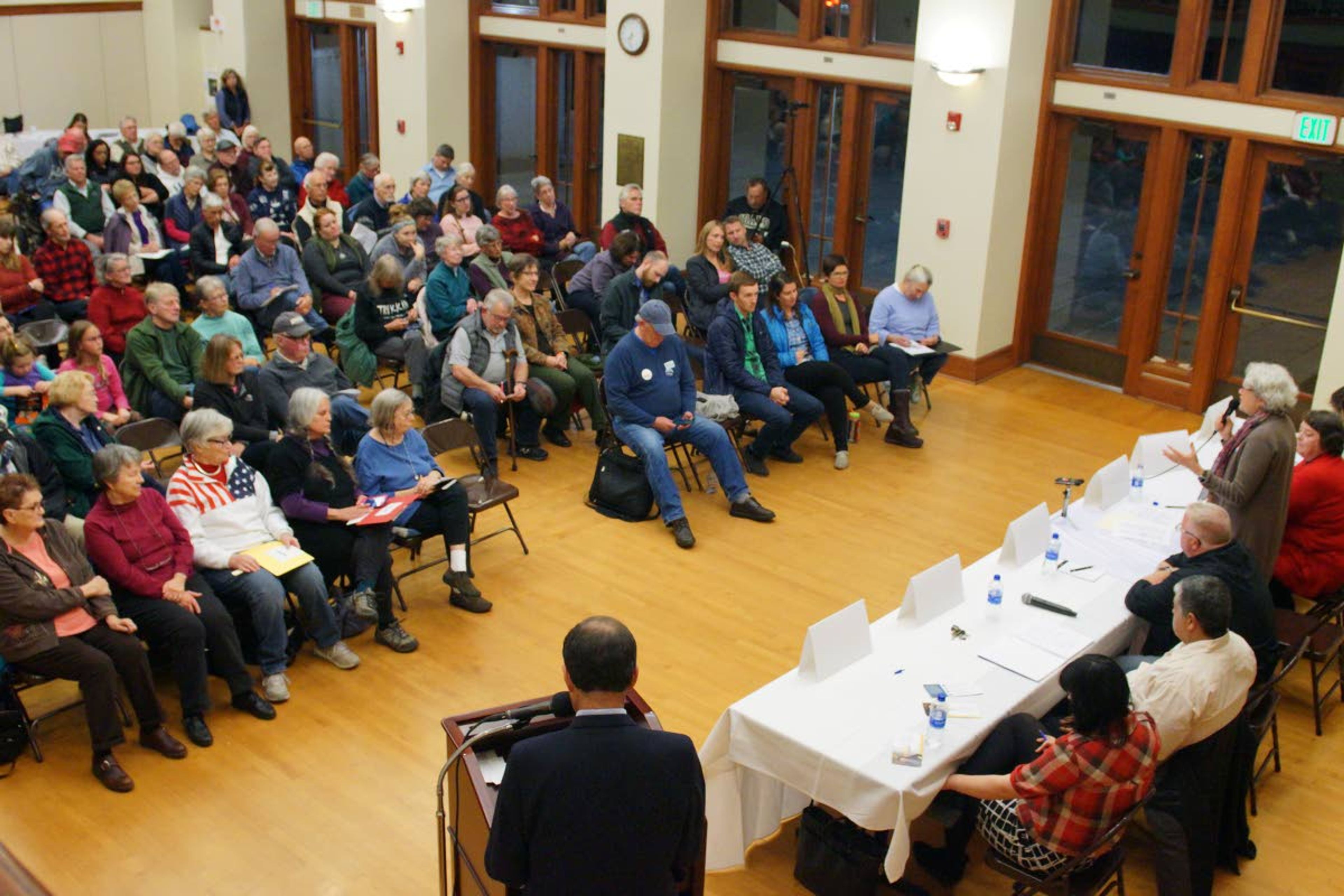 Attendees listen as Moscow City Council candidate Maureen Laflin, standing at right, answers a question during a League of Women Voters candidates forum Wednesday night in the 1912 Center.