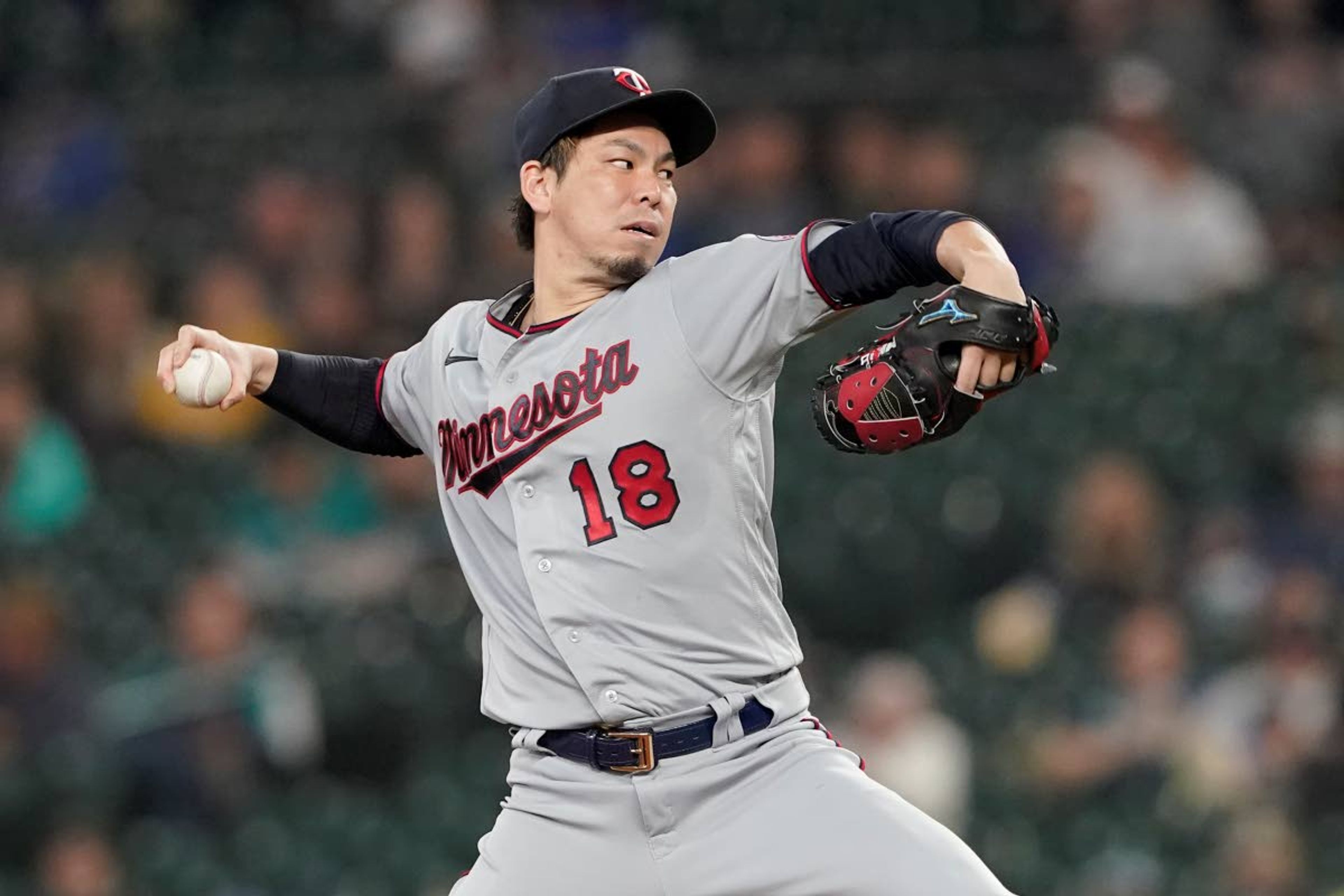 Minnesota Twins starting pitcher Kenta Maeda throws against the Seattle Mariners during the third inning of a baseball game, Monday, June 14, 2021, in Seattle. (AP Photo/Ted S. Warren)