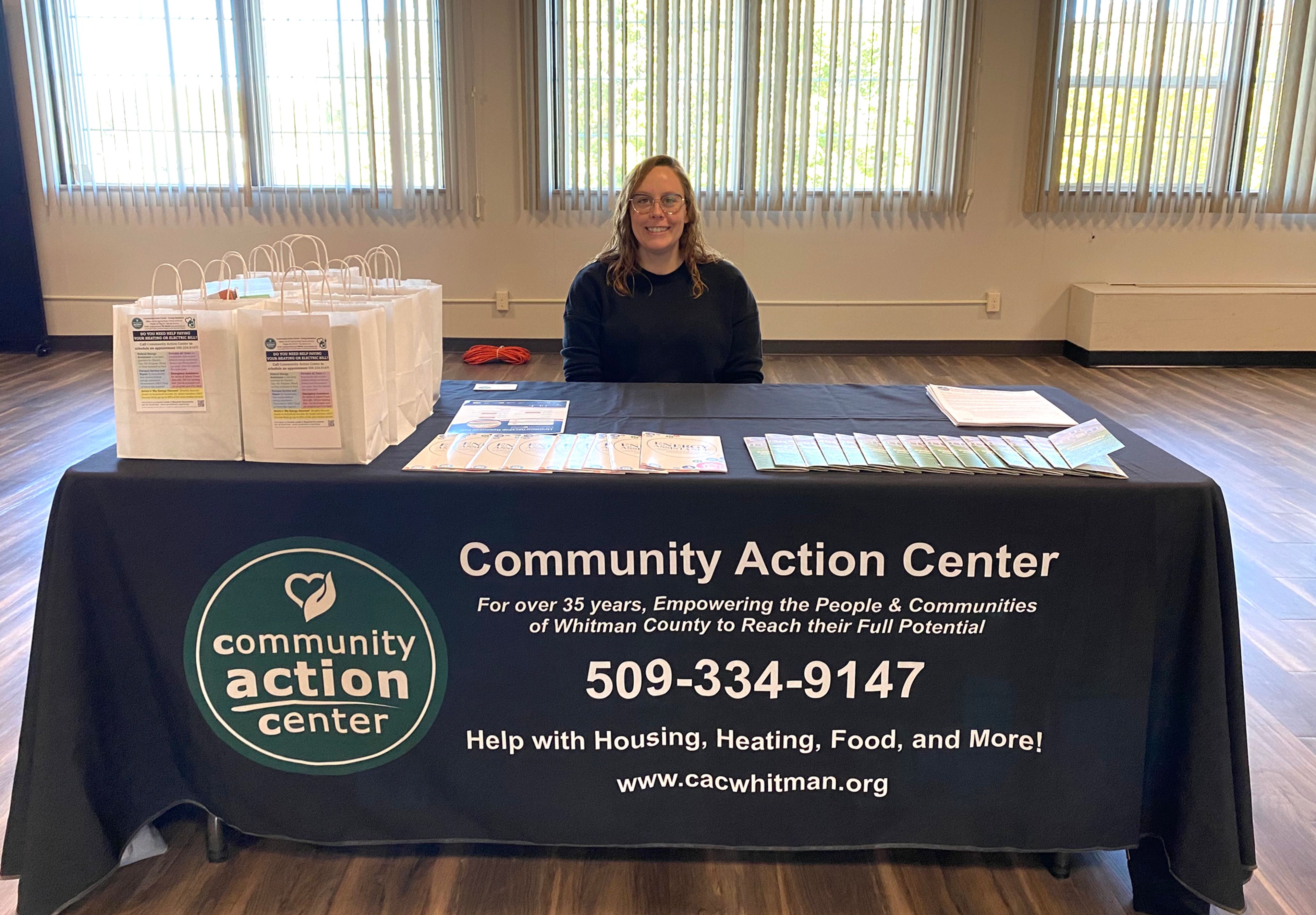 Brianna Brown, weatherization intake specialist at the Community Action Center, sits at her booth during the Homeownership Resource Fair on Saturday at the Gladish View Room in Pullman.