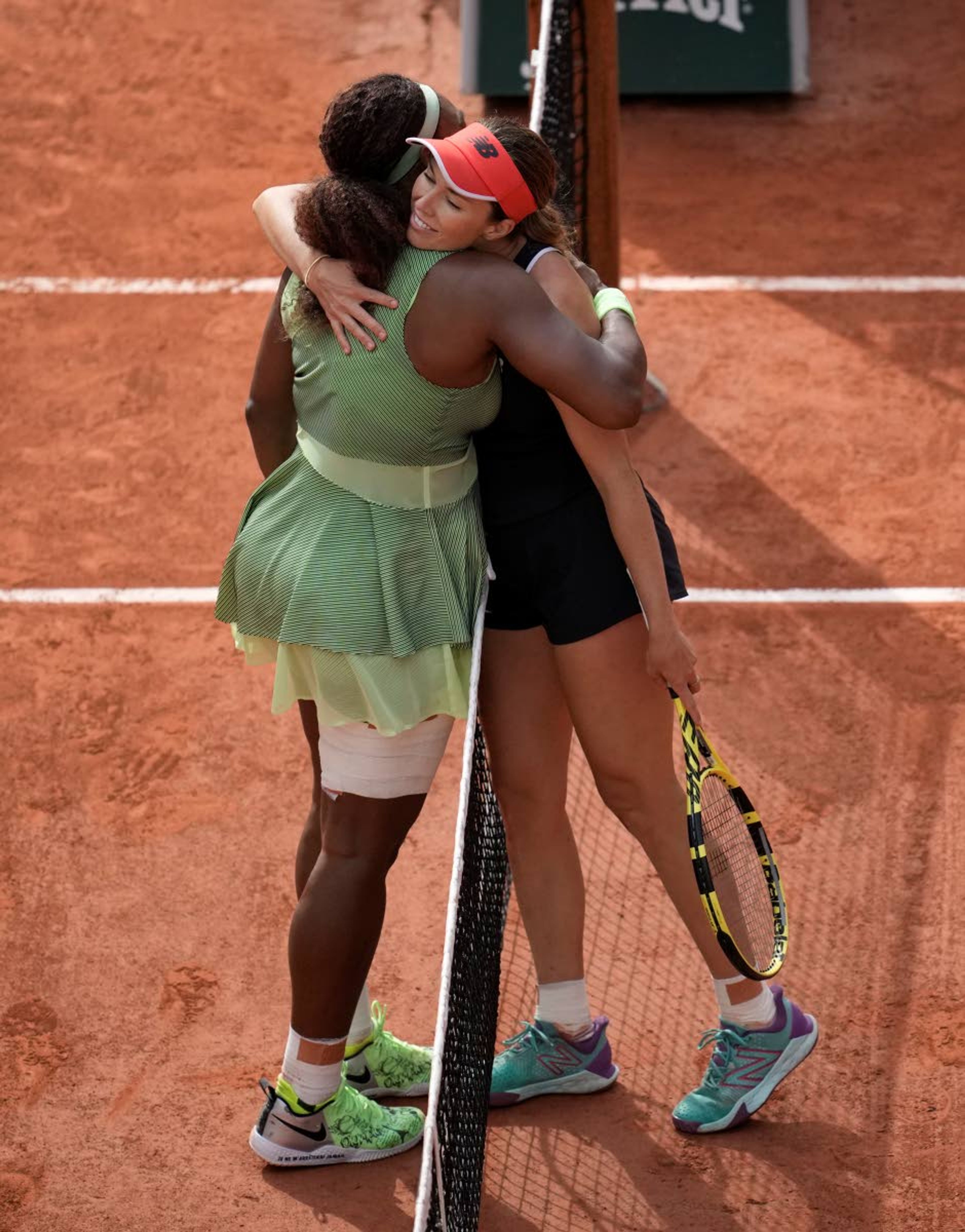 United States Serena Williams, left hugs United States's Danielle Collins after she defeated her in their third round match on day 6, of the French Open tennis tournament at Roland Garros in Paris, France, Friday, June 4, 2021. (AP Photo/Christophe Ena)