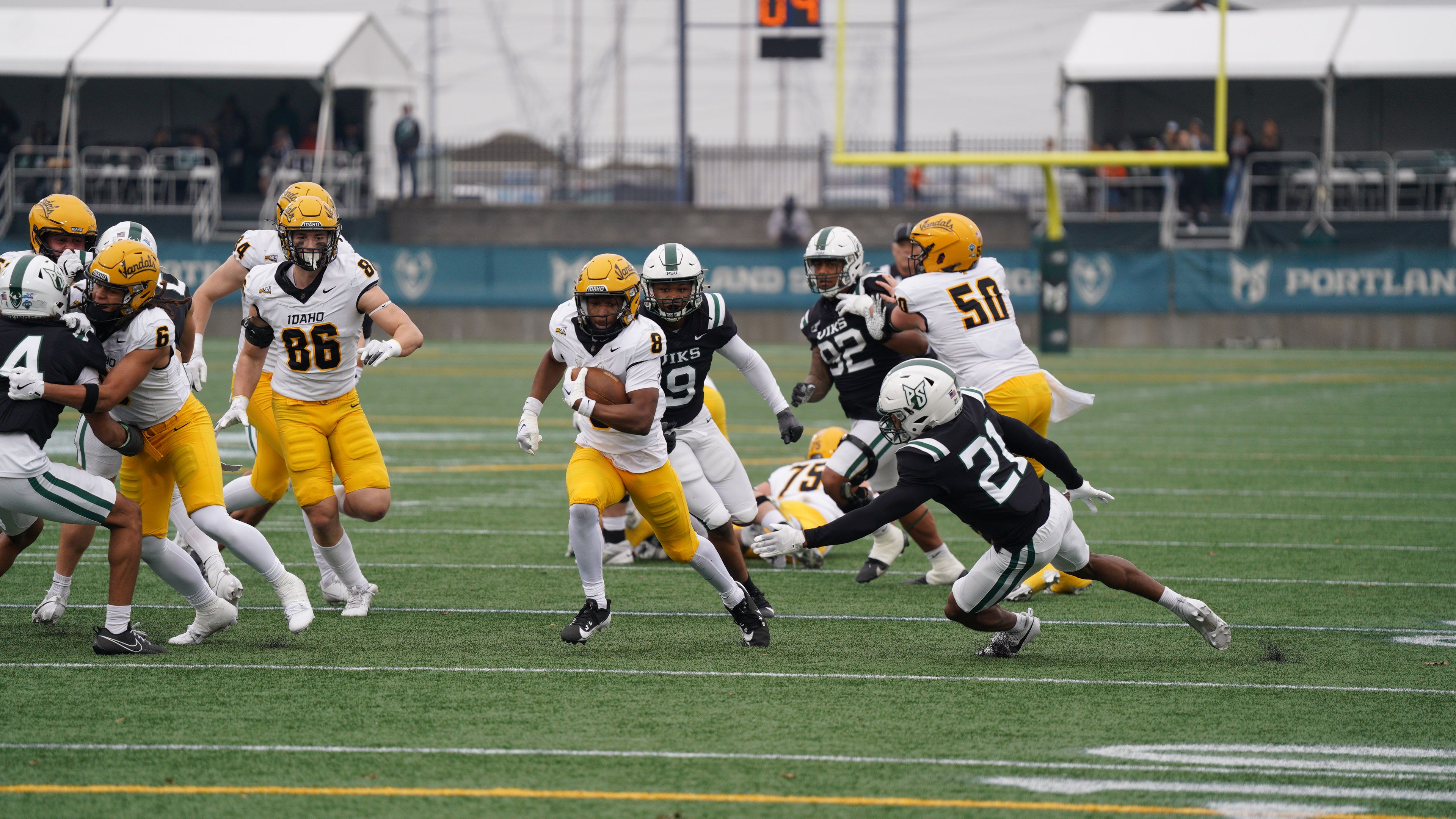 Idaho running back Deshaun Buchanan, center, breaks free for a run during a game against Portland State on Saturday in Hillsboro, Ore.